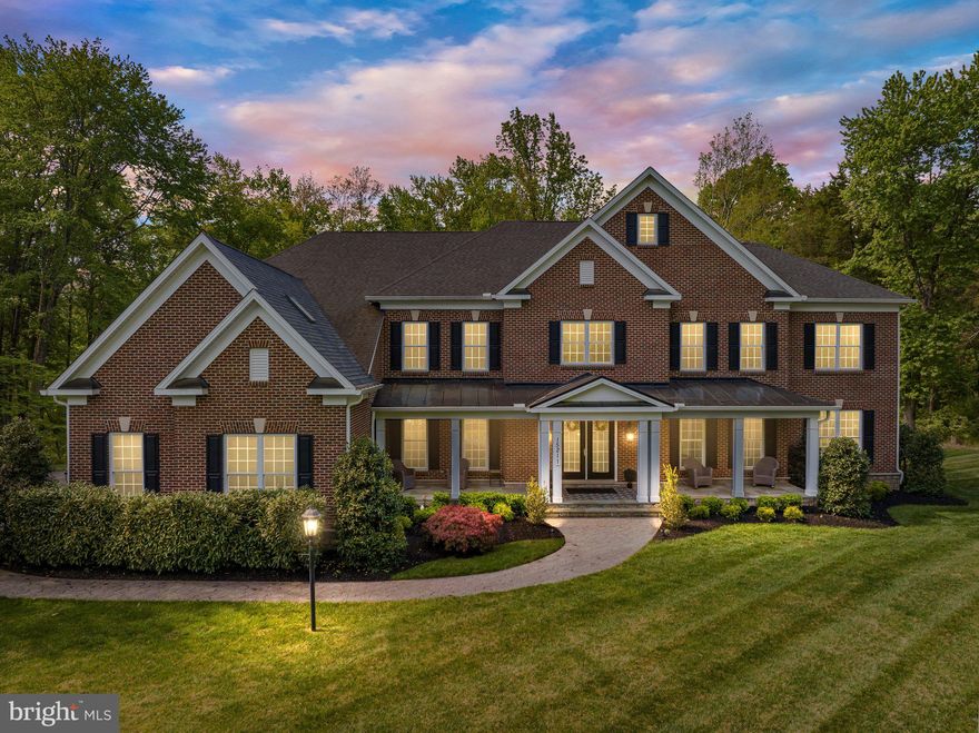 This custom home, nestled on 10 acres of serene and private land surrounded by trees in Piedmont Riding Club, boasts almost 9,000 finished square feet of serene living space. High-level engineered wood flooring runs seamlessly throughout the main level, creating a cohesive and luxurious feel. The heart of the home is the gourmet kitchen, complete with espresso cabinets and stainless GE Monogram appliances, including a 6-burner stove with grill, a walk-in pantry, and a massive island the size of a ping pong table. Step into the sunroom and enjoy the natural light that floods the room, then walk through the French doors leading to a stamped concrete patio and grassy backyard. 

The 2-story foyer with a dramatic dual staircase is a grand entrance to this stunning home. The main level features large separate dining and living rooms, a solarium that runs the entire length of the home with French doors leading to a composite deck, and a 2-story family room with built-ins and a wood-burning fireplace with a stacked stone surround reaching up to the coffered ceiling. A separate office with custom built-ins provides a private workspace. 

Upstairs, the light and bright primary suite is especially spacious, with a tray ceiling, a sitting area,  an ample linen closet, and an enormous walk-in closet the size of another bedroom. The primary bath features a huge soaking tub, a 2-person shower with multiple shower heads, a private water closet, and plenty of space to pamper yourself. The three additional bedrooms upstairs each have a private bath, ensuring the utmost comfort and privacy for family and guests.

The walk-up lower level adds even more living space, including a fifth bedroom with a dual entry full bath, a billiards/game area, a carpeted media room, and a gym. The high-traffic entertainment areas of this level have high-quality LVP. One area is primed for your creative touch to create your own second kitchen or bar, with a full sink and plumbing for a fridge with an ice maker.

This beautiful custom colonial home on 10 private acres is an oasis of comfort, and privacy.