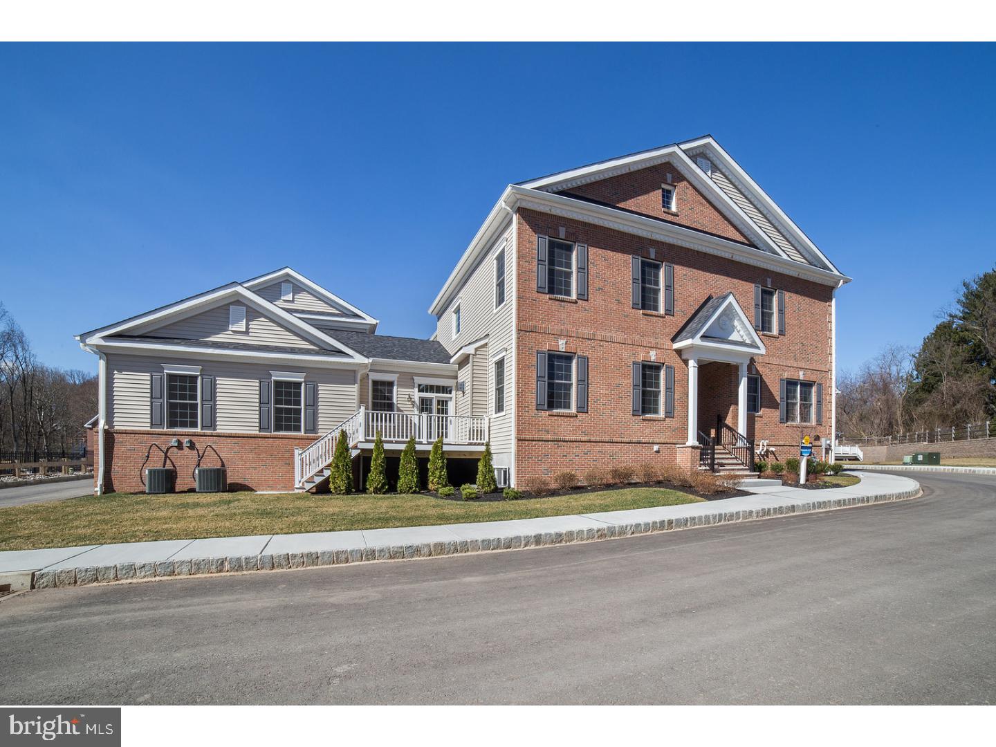 OPEN HOUSE! From the moment you turn into the welcoming, tree-lined entry of Yardley Walk, a new luxury enclave of 63 sophisticated townhomes in desirable Bucks County, you will know you have arrived in an extraordinary community.  A pleasant stroll across the pedestrian bridge provides delightful scenery in all seasons and leads to the quaint, historic village of Yardley. Elegant brick facade leads to the entrance of this stately home. Designed with an open plan that is ideal for entertaining, the spacious feel of the main level is enhanced by dramatic 10' ceilings, an abundance of windows that fill the space with light and 7.5-inch plank, scraped-oak hardwood flooring. Featuring handsome crown molding and picture frame wainscoting, the foyer, large dining room and living area present an exquisite canvas for your decorating ideas and offer the flexibility to fit your lifestyle.  Flanked on one side by a casual dining space with sliding glass doors that lead to a private deck and by a well-designed butler's pantry on the other, the gourmet kitchen, with its rich, dark cherry Shaker-style floor-to-ceiling cabinetry and a stylish tiled backsplash, has everything you would expect: granite countertops; an over-sized, deluxe island with extra-deep sink; soft-close draws with plenty of specialty pullouts; decorative wooden hood; GE Profile stainless steel appliances, including a 5-burner gas cooktop, wall oven & microwave and a big, walk-in pantry. The kitchen opens to a sunlit living area that features a handsome stacked-stone, floor-to-ceiling fireplace. Also on the main level are a powder room with pedestal sink, access to the attached, two-car garage with carriage-style doors, and access to the full, poured-concrete basement, which, with a 9' ceiling offers a perfect opportunity to add your personal design and finishes. A graceful staircase leads to the upper level which accommodates the main bedroom suite, two good-sized additional bedrooms, hall bath, hall closet and the laundry room. The large main bedroom suite includes 3 closets?two that are walk-in?and a spa-like bathroom that features two granite-topped vanities a separate, walk-in closet and spa-like bathroom. No need to wait! Immediate occupancy & quick-delivery. Enjoy maintenance-free living in a perfect alternative to a single home. Easy access to New York, Princeton and Philadelphia make commuting and urban excursions a readily available convenience. Highly rated Pennsbury School District.