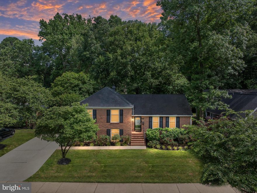 Charming Home on The Crofton Parkway – A Must-See Gem!

1589 Crofton Pkwy is located in the “Georgetown/Williamsburg”-inspired section of Old Crofton and is one of the community’s original Crawford Corporation-built homes. Set on the 2nd fairway of the Crofton Country Club, this home offers timeless curb appeal, a spacious layout, and modern updates throughout—perfectly blending charm and convenience.

Step into the inviting foyer with original hardwood floors that extend through the main and upper levels. The spacious living room offers abundant natural light and stunning views of the golf course. The dining room sits between the kitchen and living room, making it ideal for entertaining. The recently remodeled kitchen features quartz countertops, a marble backsplash, three-year-old stainless steel appliances—including a drawer microwave—a walk-in pantry, and a large island that seats four, all surrounded by beautiful white cabinetry.

The family room is filled with natural light and overlooks your private, fenced backyard oasis, just steps from the golf course. Upstairs, the expansive primary suite includes a walk-in closet and en-suite bath, while two additional generously sized bedrooms offer plenty of closet space and share a fully updated hall bath with modern finishes.

The lower level features a comfortable fourth bedroom or office with its own fully updated bathroom, new LVP flooring, a large wood-burning fireplace, and a four-season room with dedicated heating and cooling that opens to a spacious stone patio.

The professionally landscaped yard includes an 8-zone in-ground sprinkler system and a variety of flowering trees and perennials that bloom from spring through fall—rose bushes, cherry blossoms, rhododendrons, hydrangeas, crape myrtles, and Japanese maples. Mature trees provide shade and privacy, while a one-car garage and extended driveway offer parking for up to four cars.

A 30-year architectural shingle "Timberline HD" roof and gutter guards were installed in 2017. The scenic, tree-lined Crofton Parkway is a 3.5-mile loop perfect for walking and biking. Residents enjoy access to the Crofton Country Club, Crofton Swim & Tennis Club, and award-winning Crofton schools, including the newly built Crofton High School. Crofton Elementary and nearby ballfields are just two blocks away.

Also within walking distance are Hardy Park and Field (with baseball, soccer, basketball, and a playscape), Crofton Town Hall, and the Crofton Police Department. The Crofton Triangle community hosts many fun events, including the Cherry Blossom Festival, Easter Egg Roll, ice cream socials, concerts on the green, craft fairs, and a dog show festival.

Located just minutes from Waugh Chapel Town Centre, Route 3, Fort Meade, and with easy access to Annapolis, Baltimore, and D.C., this move-in-ready home is a rare opportunity to live on one of Crofton’s most iconic streets.

Don’t miss your chance—schedule your private showing today!