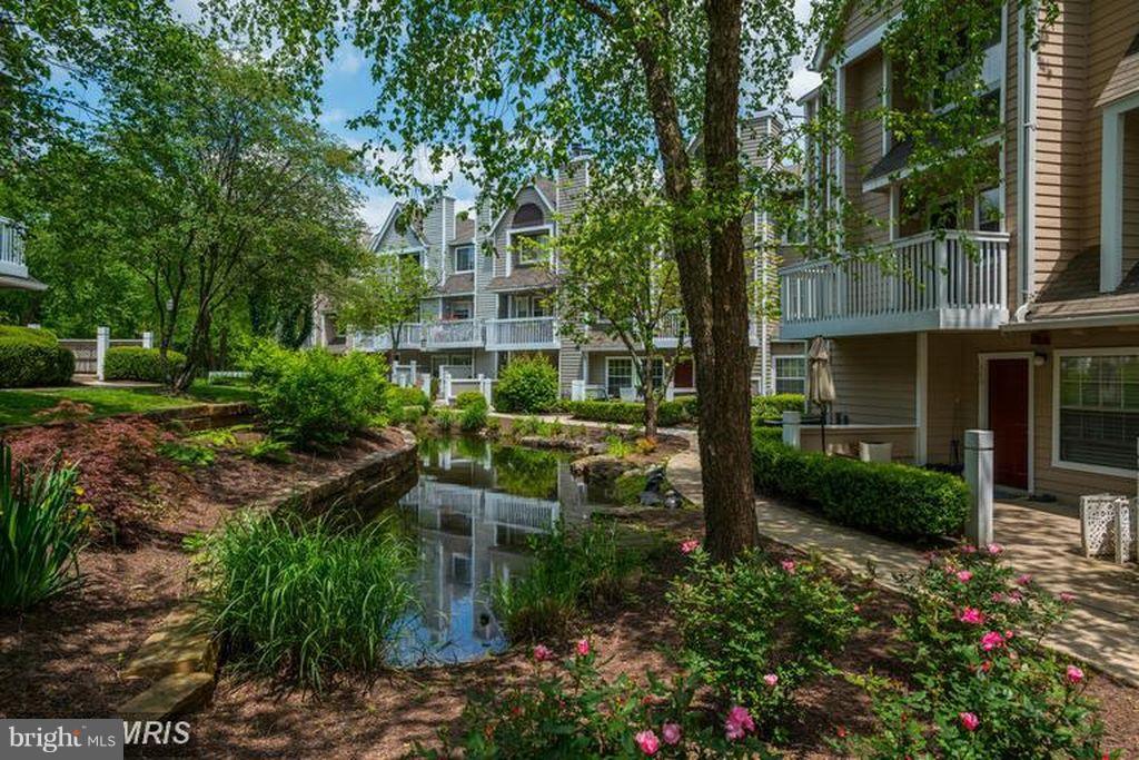 Beautiful 2-lvl condo in the heart of N Bethesda. Updated unit w/ waterfall view! Open living area w/laminate floors & wood fireplace. Separate dining area. Freshly painted! Many closets. Relaxing patio w/ water view. Upper level w/ 1BR/1BA. MBR w/ treed view & walk-in closet. Stacked W/D in unit on bedroom lvl. Common area permit parking. Gym, pool, palyground, clubhouse & tennis courts! No pets.
