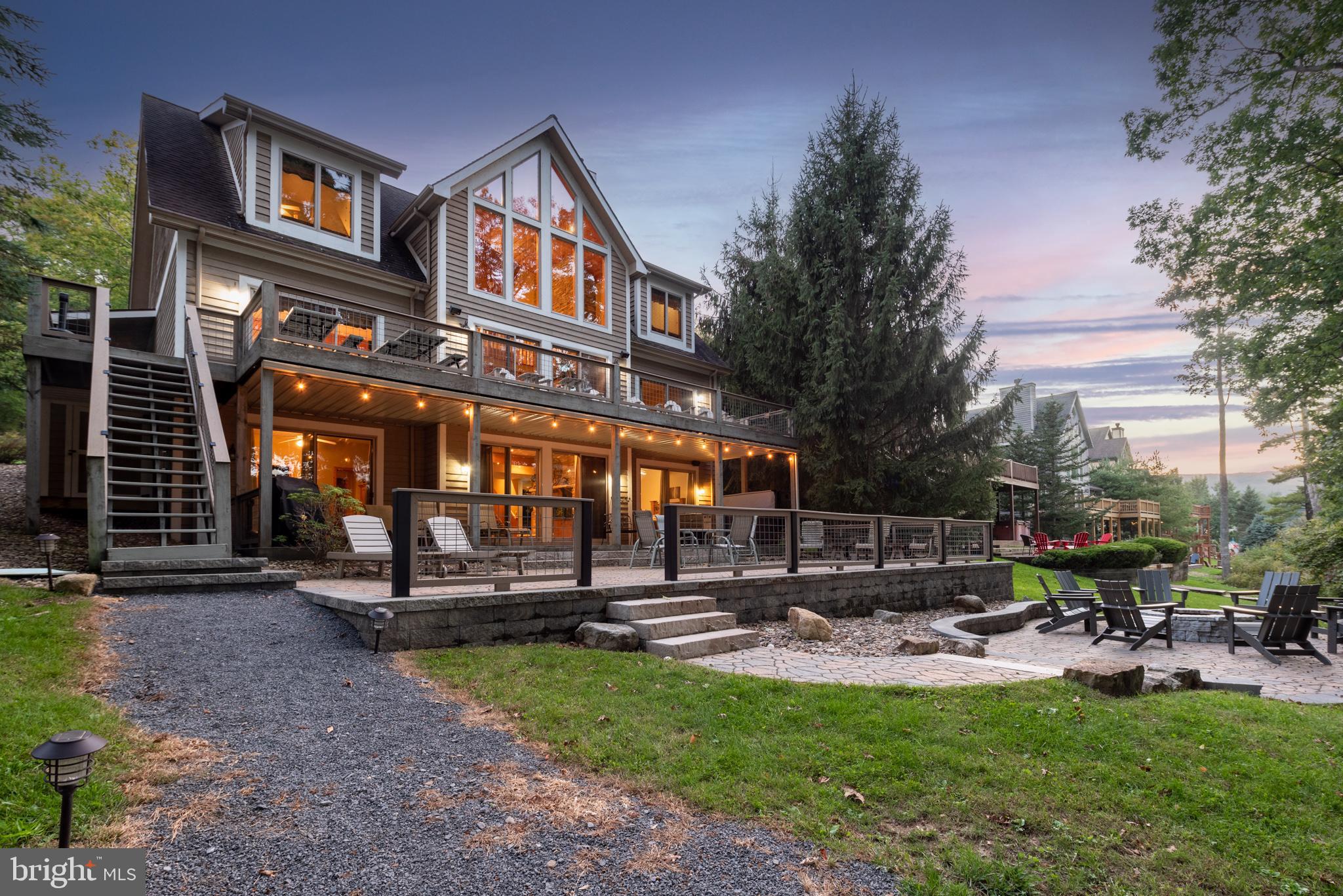 Almost Aspen on Deep Creek Lake! You'll be in the heart of everything Deep Creek and Garrett County have to offer with this 7 bedroom 6.5 bath lakefront modified chalet. Offering 8 separate gathering places both inside and outside of the home, you'll have the perfect opportunities to relax with your group and or getaway for some personal time.
With 4 private suits, direct bath access from every bedroom, 2 fireplaces, a fire pit, hot tub, decks, covered porch and a direct path to the level lakefront /dock area, the property offers convenience and comfort regardless of the occasion.
Located less than 1 mile from many of the lake's best restaurants, movie theatre, shopping and outdoor entertainment options. You're less than 2 miles from Deep Creek Lake State Park and located within a short drive of championship golf and the Wisp Ski Resort. Great rivers and hundreds of acres of state lands are all close by offering spectacular recreational opportunities for every outdoor enthusiast.
Almost Aspen is also a great rental averaging over $ 150,000.00 in gross annual rents over the past several years. The owners have done a great job in maintaining the property as well insuring an easy transition for the new owners.
Note, that showing times are limited to times when the property is not rented and or is transitioning between rentals.