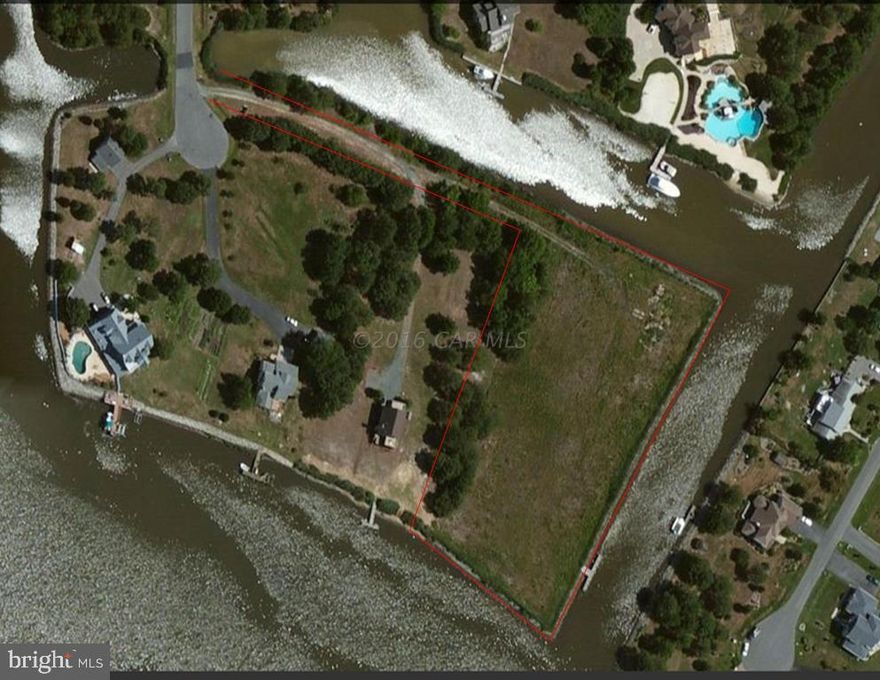 Beautiful, private bayfront setting with private drive. NO HOA fees.  Approximately 4.44 acres of refuge with 50ft pier,10,000 lb boat lift,  deep water and 1,100ft of riprap.  Short boat ride or car ride to Ocean City.