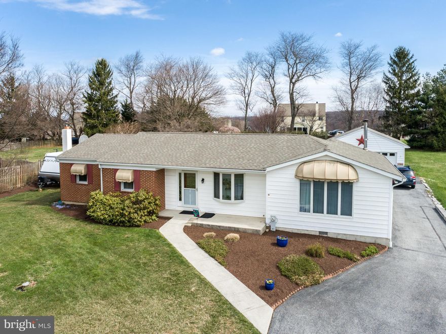 Just what you have been waiting for.....From the moment you step inside this beautiful Rancher you will fall in love! Home features a gorgeous living room with cathedral ceiling, ceiling fan and a beautiful stone hearth/wall with a self cleaning pellet stove to keep you warm on those chilly nights, open up the pocket doors to enter the lovely dining room with hardwood floors and a big bay window to allow plenty of natural light.   The kitchen is large enough for another table for gatherings.  Talk about gathering, this kitchen comes with not only a Range but a wall oven and built-in microwave, lots of counter and cabinet space and lets not forget that pantry.  Just out from the kitchen is an amazing 3 Seasons Room.  Sit out here and enjoy your morning coffee while watching your beautiful flower gardens.  Primary Bedroom has not only its own bath but a dressing area and huge walk-in closet with built-ins.  there are 2 other generous size bedrooms, a large full bath and laundry to complete this main level.  Once downstairs, you will find a  nice Family room with another pellet stove, a room that could be used as a home office or den, and 2 other rooms for storage.   Oh, and let's not forget about the amazing oversized 2 car detached garage.  There is  a workshop in the back and plenty of storage in the floored attic with pulled down stairs.  Make your appointment today!