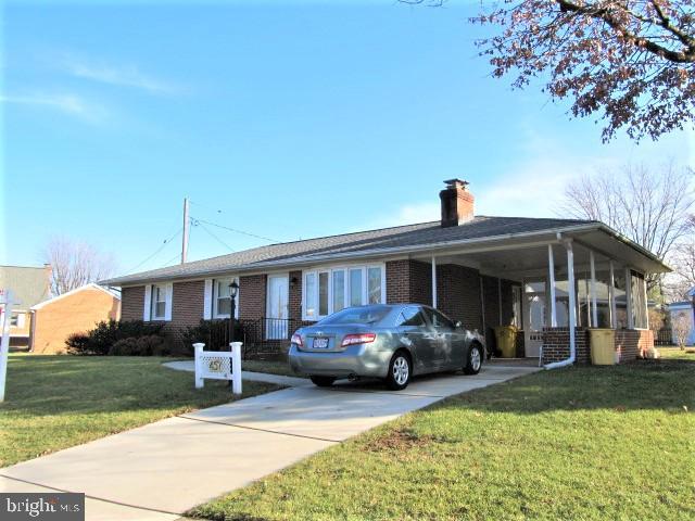 BEAUTIFUL all brick Rudy York rancher with carport! Featuring gleaming hardwoods throughout the main level, lovely stone fireplace, and absolutely gorgeous fully renovated baths! Fully finished lower level family room with almost new carpet! This home has had a lot of upgrades and is move-in ready!