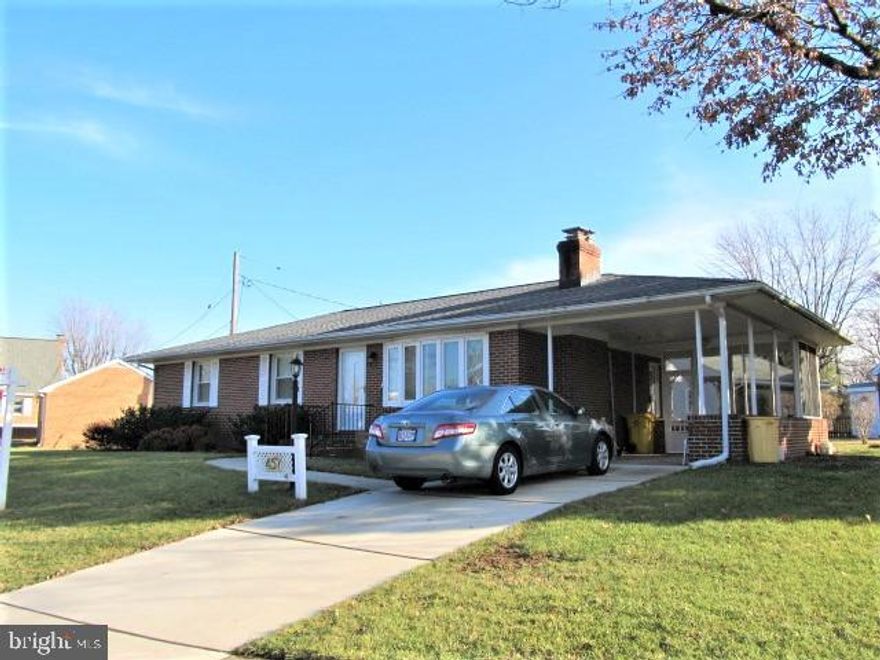 BEAUTIFUL all brick Rudy York rancher with carport!   Featuring gleaming hardwoods throughout the main level, lovely stone fireplace,  and  absolutely gorgeous  fully renovated baths!   Fully finished lower level family room with almost new carpet!  This home has had a lot of upgrades and is move-in ready!