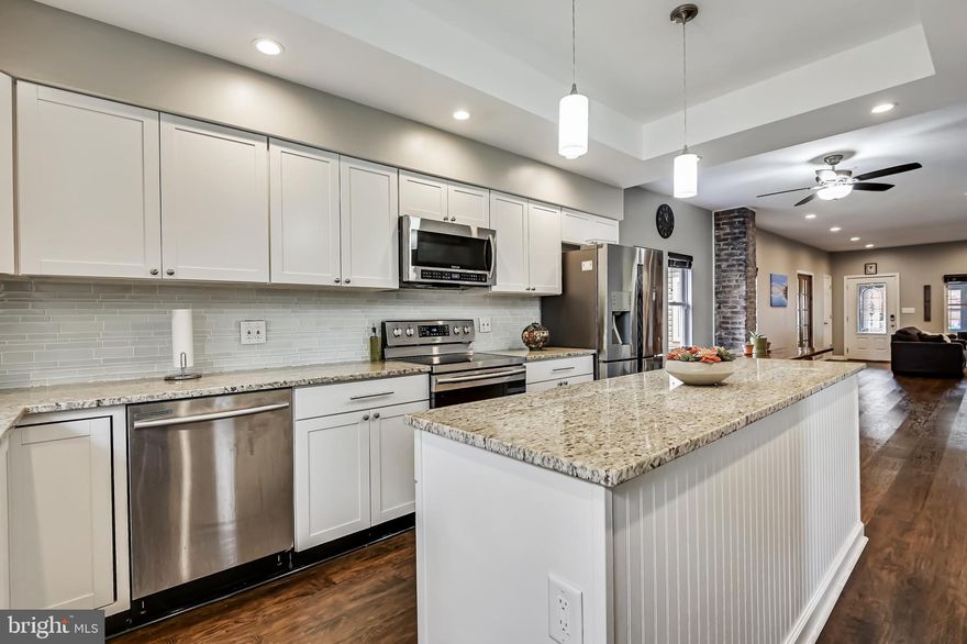 **Motivated Sellers have found their next home! Bring ALL offers ASAP** Welcome home to this completely renovated (2018) rancher in sought after Riviera Beach.  This contemporary Rancher features an open floor plan, luxury vinyl plank flooring on main level, upgraded cabinets, granite countertops, kitchen island with under counter wine cooler and stainless steel appliances. Main level hosts, open living and primary bedroom with en suite bath plus second bedroom and second bath. Upper level attic has been converted to a 3rd bedroom/rec room and is insulated with closed cell spray foam and has it's own ductless heating/cooling unit. Renovations were completed in 2018 with all new construction. Only the foundation (which has been reinforced), 4 outer frame walls and rafters are from the original structure. Too many "news" to list.