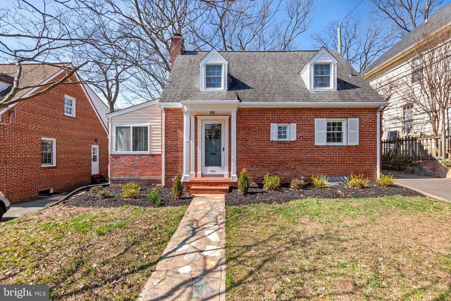 Charming brick Cape Cod in Aurora Hills on a DOUBLE LOT totaling .23 acres with upgrades throughout.  PRICED WELL BELOW TAX ASSESSMENT of $940,600 for both parcels!  Property includes two parcels on a level and deep 50'x200' lot with endless possibilities!  Expand the house or create a detached garage and still have room to play or garden.  Enjoy the fantastic Arlington amenities at a prime-time location within walking distance to everything you need.  Less than 1 mile to Crystal City Metro.  Minutes to shops and restaurants.  Convenient to National Landing, Crystal City Metro, Pentagon City Metro, Amazon HQ2, restaurants, DCA airport, Whole Foods, sidewalks and bike trails for miles, several parks, and library.  Hardwood floors and ceramic tile throughout with updated vinyl windows.  The front door opens into a tile foyer with coat closet and  a large living room with a bonus room off to the left.  Home has a 14 x 8 bonus room on main level with tons of potential for a guest bedroom/ office/den/home gym.  Living room has a woodburning fireplace, and opens into the large dining room.  The kitchen is off the dining room and was updated with granite countertops.  Up the hardwood staircase to the bedroom level, you'll find 2 large guestrooms with built in drawers as well as closets and a full bathroom between them with linen storage.  There is additional attic storage, a storage/utility room in the basement and a shed outside.  In the lower level there is a rec room and the third bedroom with new tile floors leading to a full bathroom and walk-in closet.  Lower level has a private walk up exit to the back yard.  New landscaping, brick paver patio, paved driveway extends into back yard for additional parking or storage options.  Short walk to restaurants, shopping and a several parks- Eads Park, Fort Scott Park, and Virginia Highlands Park.  15 min walk to Crystal City Metro!  Can't beat the location and convenience!