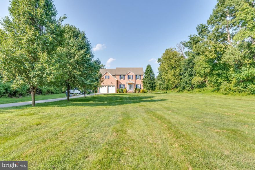 Beautiful Brick front Colonial on a large secluded lot. This home has so much to offer with 5 bedrooms, large gourmet kitchen with Corian counters and Plenty of cabinet space! Large family room and Loft/Rec area at the top of the stairs that is great for entertaining. Step outback to an oversized covered deck and enjoy the beautiful nature surrounding you.Separate lot included that is buildable