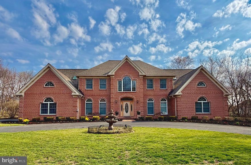 Experience unparalleled luxury in the prestigious Pinehurst community, within the Cumberland Valley School District. This stunning estate boasts 9 bedrooms, 7.5 bathrooms, and over 9,500 sq. ft. of thoughtfully designed living space, combining 7,000 above-grade and 2,500 below-grade square feet. The grand foyer impresses with soaring two-story ceilings, a chandelier on a lift, granite floors to match the kitchen, and a sweeping curved staircase. Entertain effortlessly in the formal dining room with a wet bar. The open-concept kitchen features a large island with granite countertops matching the custom made dinette table. The kitchen flows seamlessly into the spacious family room.  The sunroom with skylights floods the main floor with beautiful natural lighting.  The main floor also includes a half bath, laundry, main primary suite with walk-in and cedar-lined closets, a spa-like bath, private office, prayer room, and in-law quarters with a full bath. Upstairs, a spacious loft, 6 additional bedrooms, and 3 full baths provide ample space for guests. The lower level is an entertainer's dream with a great room and a three-sided fireplace, dance floor with built-in speakers, a fully equipped kitchen, arts and exercise rooms, and 3 storage rooms. Convenient access from the 3-car garage to the basement. Outside, enjoy your private oasis with a covered patio, expansive deck, lighted pickleball/multi-purpose court, and extensive hardscaping—ideal for relaxing or hosting gatherings. This home is the perfect blend of grand elegance, thoughtful design, and exceptional amenities. Don't miss this rare opportunity to own in one of the area's most coveted communities - schedule your private tour today.