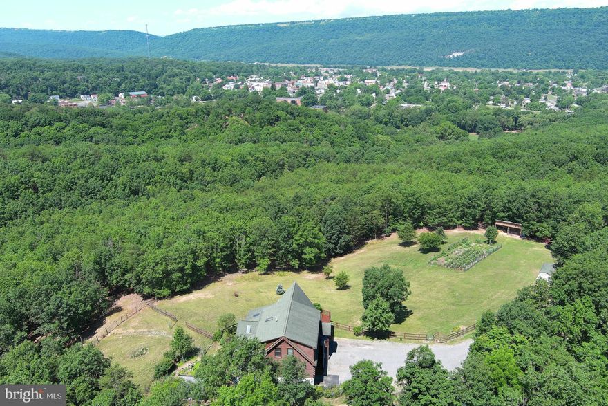 LOOK!!!!  BEAUTIFUL LOG HOME OF YOUR DREAMS!! LOCATED CLOSE TO CIVILIZATION!!!  3   BEDROOM 3 BATH LOG HOME WITH 20 ACRES OF LAND AND ROOM FOR A FEW FARM ANIMALS!!!
THE PICTURES TELL THE STORY OF THE BEAUTY OF THE HOME AND FANTASTIC LONG - RANGE VIEWS AND A POND , TOO.   CALL US TODAY FOR YOUR PRIVATE SHOWING!!!  GATED COMMUNITY!!!