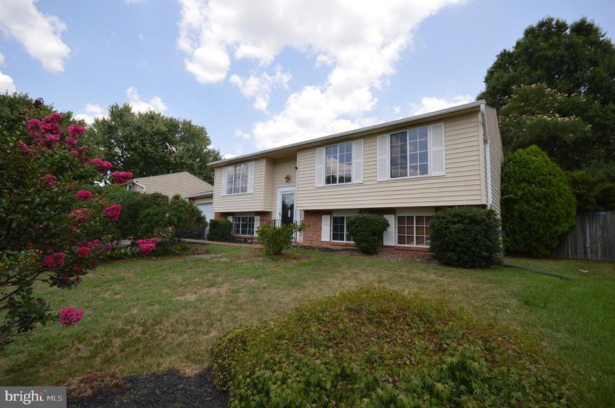 A very nice and clean 4-bedroom, 3 full bath single-family home with a garage in Alexandria's popular Stoneybrooke neighborhood. This house boasts beautiful hardwood floors in the living and dining rooms, hallway, and all three upper-level bedrooms. The basement features newer laminate floors, an updated full bath, and a fourth bedroom. The entire house has been freshly painted. The recently updated kitchen includes granite counters with a custom tile backsplash and matching appliances. Steps from the dining room lead to a refurbished double deck with built-in bench seating. The fully fenced backyard has beautiful landscaping.  This home is conveniently located near the Metro, Ft. Belvoir, Lee District Park, Kingstowne Town Center, and all major commuter routes.