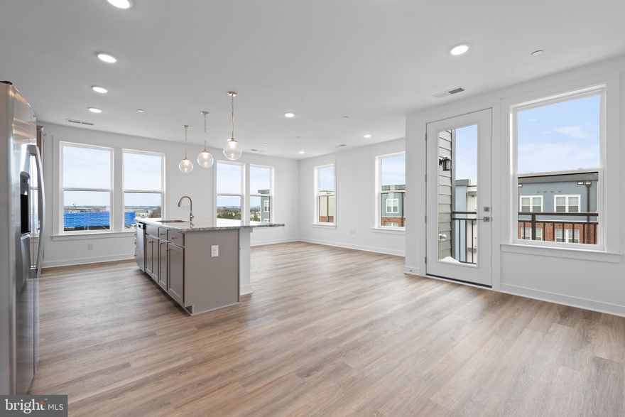 Brand new, never lived in luxury condo in IDEAL Ashburn location - convenient to shopping, metro and major roads - AND AVAILABLE FOR IMMEDIATE MOVE-IN! Over 1500 square feet of living space - including "bonus" flex room perfect for home office (or a home gym, if that was your resolution!)  Designed for modern living, with an open floorplan and contemporary fixtures and features, including luxury vinyl plank flooring, gourmet kitchen with center island, granite countertops and stainless appliances (gas cooking!) and stunning primary bath with large frameless shower.  Charming balcony! GE front loading washer and dryer! Garage Parking Spot! The Residences at Waxpool Crossing will be offering desirable common spaces for future residents, including dog grooming spa and park area, community room, cozy lounge area, pickleball court, and an outdoor grill/picnic area.  Sorry, no pets/smoking! Landlord is looking for 12 month lease terms.  Showings available starting 1/15