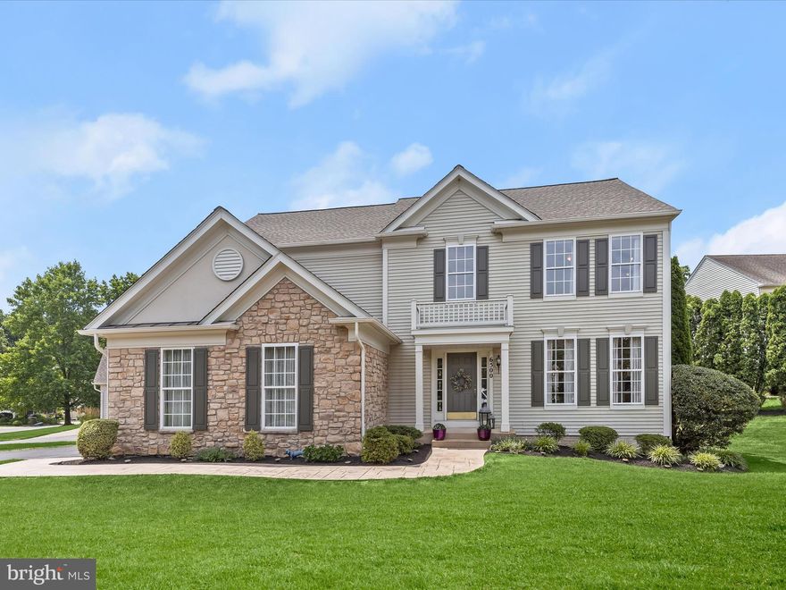 Welcome to this stunning stone accented colonial home, perfectly situated on a corner lot of over a quarter acre in Clarks Glen. A stamped concrete walkway, mirroring the stone front, leads you through beautifully landscaped surroundings to the grand entrance. Step into the impressive two-story foyer, which features elegant box wainscoting that continues up the stairs, creating a timeless and sophisticated look. The foyer opens to the formal living room and adjacent formal dining room, perfect for entertaining. The kitchen is a chef's delight with 42-inch cabinetry,  granite counters with a beveled edge, an island, and brushed stainless steel appliances that resist fingerprints. The breakfast room, filled with natural light, features a triple panel sliding glass door that opens to the deck. This deck boasts built-in bench seating and overlooks a backyard lined with mature trees, offering a perfect blend of comfort and scenic beauty. The family room, just off the kitchen, boasts a fireplace with molding that extends to the ceiling, creating a cozy and elegant atmosphere. Upstairs, the primary bedroom offers a tranquil retreat, complete with an en-suite bath highlighting a double vanity, soaking tub, tiled separate shower, and a walk-in closet. Three additional bedrooms, a full bath with a double vanity, and a conveniently located laundry room complete the upper level. The unfinished lower level, with a rough-in for a bathroom, presents an opportunity for customization to suit your needs. Practical updates include a roof replacement in 2019, a side-loading, two-car garage with an asphalt driveway redone in 2018, and kitchen appliances replaced in 2022. Enjoy the best of Clarksville and River Hill amenities, including shopping, dining, and entertainment. With easy access to commuter routes MD-32 and MD-108, convenience is at your doorstep. Property Updates: Roof (50 year shingles), kitchen appliances, asphalt driveway, HVAC, washer & dryer, and stamped concrete walkway.