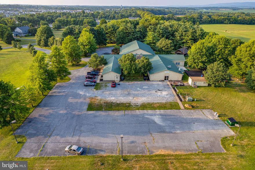 Approximately 14,000 sqft.  11 spacious rooms currently used as classrooms (2 with dedicated outside entrances) plus a commercial kitchen, office room, copy room, hall bathrooms, refreshment kitchen in dining/lobby/reception area. and a Auditorium with cry room.  Courtyard with lots of windows from the hall showcasing the outdoor area and faces the parking lot. There is separate outside entrance into a fenced yard currently used as a play area. Room for multiple outdoor signage. Plenty of parking. Rt 9  Frontage with high visibility.  Possible subdivision with county approval.
