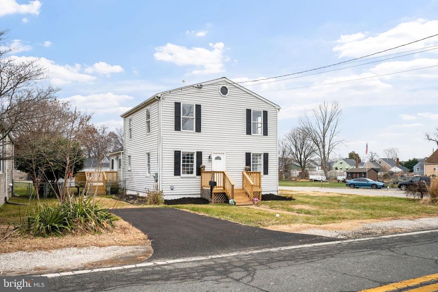 Newly remodeled 5BR/3BA expanded colonial situated on a spacious corner lot in the water oriented community near Cox's Point Park! Pull into the newly paved driveway and step inside a home designed for both comfort and style. The interior is filled with natural light and features blond luxury flooring, new carpeting, a freshly painted soft neutral palette, an open main-level layout, and numerous upgrades throughout.

The main level offers a large living room open to the dining area with sightlines into the stunning, newly remodeled kitchen. The kitchen showcases abundant cabinetry, stainless steel appliances, sleek quartz countertops with a coordinating tile backsplash, and a deep stainless-steel sink positioned beneath a window. Completing the main level is a full bath, a versatile room ideal for a home office or additional bedroom, and a main-level primary bedroom featuring a wall of closets and a private en-suite bath.

The upper level includes two spacious secondary bedrooms, an additional primary-sized bedroom, and a newly remodeled full bath with a walk-in shower. Step outside from the main level onto the newly constructed wrap-around porch overlooking the fenced yard with plenty of green space, plus a detached one-car garage and additional paved parking.

Beyond the home, enjoy the lifestyle the neighborhood near Cox's Point Park offers. Residents enjoy easy access to a public boat ramp, playgrounds, and open green space perfect for weekend cookouts and outdoor gatherings. Back River offers deep water ideal for kayaking, canoeing, and boating, with direct access to the Chesapeake Bay for even more adventures on the water. Entertainment and outdoor enjoyment truly begin just outside your door, with walkable proximity to Weavers Yacht Club and Riverside Marina for fuel and storage. 

All of this, plus convenient access to shopping, dining, and commuter routes. This is a move-in-ready home offering views, lifestyle, and community in one exceptional setting.

Buyers may be eligible to take advantage of available loan programs and grant opportunities designed to offer competitive rates and help minimize out-of-pocket expenses. Buyer eligibility to be confirmed with a preferred lender.