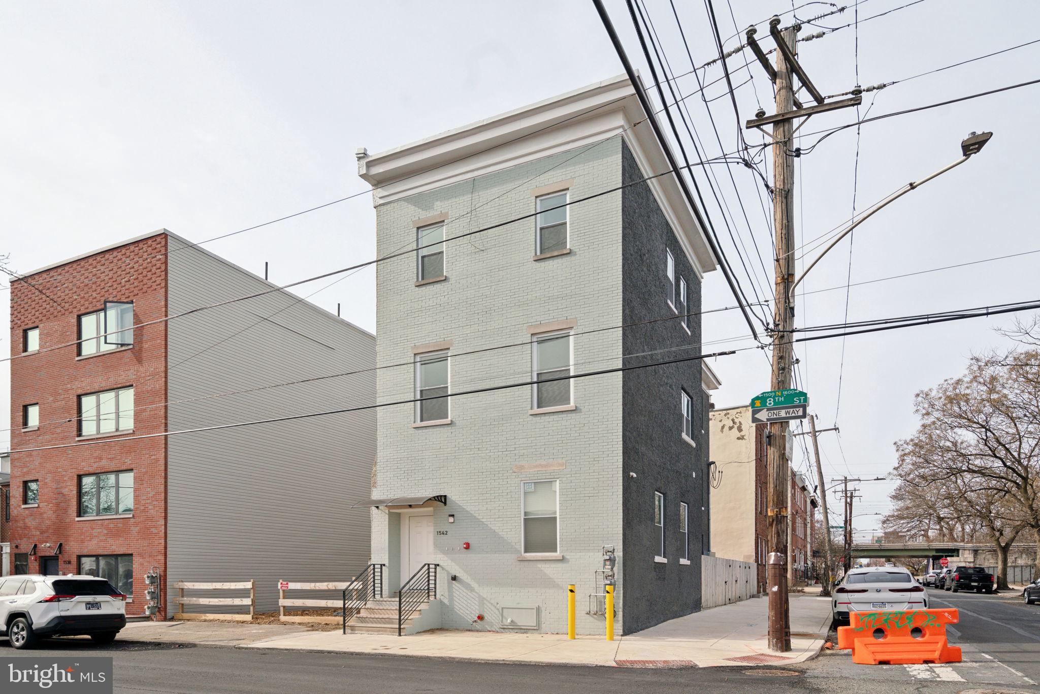 Welcome to 1542 N 8th St! This beautifully renovated triplex is in a prime location right near Temple University, Human Robot Brewery, and countless hot spots like Suraya and Pizzeria Beddia. Conveniently located near new construction and public transit, this is an investment opportunity you won't want to miss out on. On the main floor is Unit 1, a bi-level unit offering 1 bedroom,1 bathroom, and large open living space with an additional entrance through the basement. Unit 2 is a spacious 4 bed, 2 full bath, which includes a primary suite with en-suite bathroom, and a private roof deck with 360 views of Philadelphia you can't beat. Unit 3 is ground level 2 bedroom, 1.5 bathroom offering a large kitchen and living space also with an additional entrance through the basement. Each unit offers, tall ceilings, stunning hardwood flooring, granite countertops, and clean white cabinets. All units have in-unit washer and dryer hookups. They are separately metered for gas and electric. Each unit has its' own water heater and furnace.
This property would also be eligible for 5% conventional financing for an owner occupant. Live in one unit, rent out the other two, and decrease your cost of living! This is a great opportunity to invest in multi-family real estate at a low down payment.
This bright, fresh triplex won't last long - schedule your tour today!
Tax Abatement has been approved by the City. In Documents: Please see attached zoning approval and Certificate of occupancy for PERMIT FOR THE PROPOSED USE OF THREE (3) FAMILY (MULTI-FAMILY) HOUSEHOLD LIVING IN AN EXISTING ATTACHED STRUCTURE. AP 1048162 . (Per Atlas).