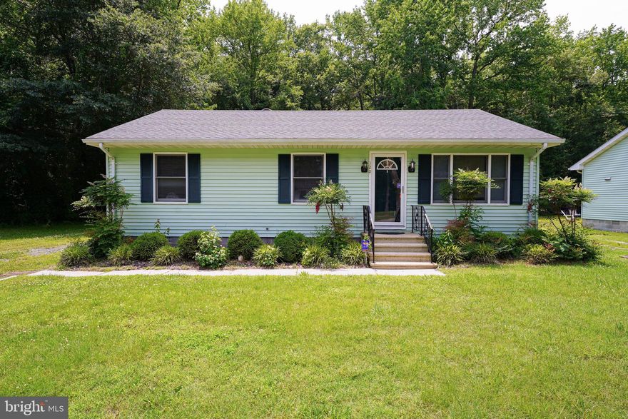 Turn-key adorable and affordable 3BR rancher with new paint throughout, new carpet in the spacious living room + all 3 bedrooms, architecturally-shingled roof installed August 2021! On a nice-sized lot backing to trees, down a no-through street, yet less than a mile to Rt 13, less than 2 miles to Fruitland's big-box store shopping/dining hub - or 4 miles to more unique shopping, dining, and events in Downtown Salisbury. Bright and breezy living room with triple windows for tons of sunlight. Roomy eat-in kitchen with an ample dining area - tile flooring, laundry room w/ ceramic tile floors. 3 bedrooms - ceiling fan in each, fresh paint, new carpet. Full bathroom w/tub/shower combo, tile flooring. Large paver brick patio overlooks your yard. Call today to learn how to make this charming house your new home! Sizes, taxes, distances are approximate.