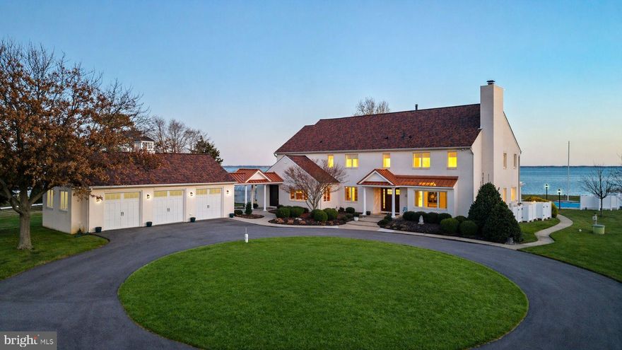 Welcome to 200 Mallard Cove, a rare 15-acre waterfront estate on Maryland’s Eastern Shore, just 23 miles from Annapolis and moments from the Bay Bridge. This private coastal retreat offers an extraordinary blend of refined living, panoramic Chesapeake Bay views, and the wide-open feeling that defines life on the Shore.

A long, 1/4-mile paved driveway leads you through acres of manicured land, a freshwater pond alive with wildlife, and nearly five acres of farmland before opening to the stunning residence and sweeping views of the Bay. With approximately 450 feet of protected shoreline, stone revetment, and a substantial pier with 10,000 lb lift providing 3’ MLW, the property is perfectly suited for boating, fishing, and waterfront exploration.

Anchoring the outdoor experience is the bayside pool and pavilion, where cascading waterfalls, lush landscaping, and bayside sunrise views set the tone for effortless entertaining. Whether hosting gatherings by the water, relaxing by the pond, or enjoying the surrounding acreage, the lifestyle here is unmatched.

The custom home has been updated and maintained to the highest standards, with thoughtful design, quality materials, and timeless coastal architecture. The waterside kitchen features high-end appliances, including a Viking gas stove, travertine flooring, a center island, and a dining area that opens to a four-season patio room overlooking the Bay. Formal living and dining rooms with cherry floors and a gas fireplace create warm and inviting spaces for year-round enjoyment. A soaring two-story great room with an elevated hearth anchors the main level, complemented by a private study, walk-in pantry, and a custom Irish Pub, offering a touch of character rarely found in waterfront homes.

The waterside primary suite features a vaulted ceiling, broad Bay views, and a spa-inspired bath. Three guest bedrooms and two additional baths on the second floor provide ample accommodations for all your guests. Connected by a breezeway, the three-bay garage offers exceptional storage for vehicles, boats, and outdoor equipment.

Additional amenities include solar panels for ultra-efficient energy use and a raised elevation that keeps the home and its infrastructure above FEMA flood designation, offering added peace of mind. A greenhouse, shed, and multiple outdoor living spaces are designed for both relaxation and entertaining. With neighbors set back 300–400 feet on either side, privacy is inherent.

Perfectly positioned near Annapolis, St. Michaels, Kent Island trails, and miles of scenic countryside, this home offers an unparalleled waterfront lifestyle with the ideal blend of privacy and convenience.

200 Mallard Cove is a truly exceptional Eastern Shore estate; an inviting waterfront oasis where every detail has been carefully curated. Come experience the breeze, the views, and the extraordinary sense of place that define this remarkable property.