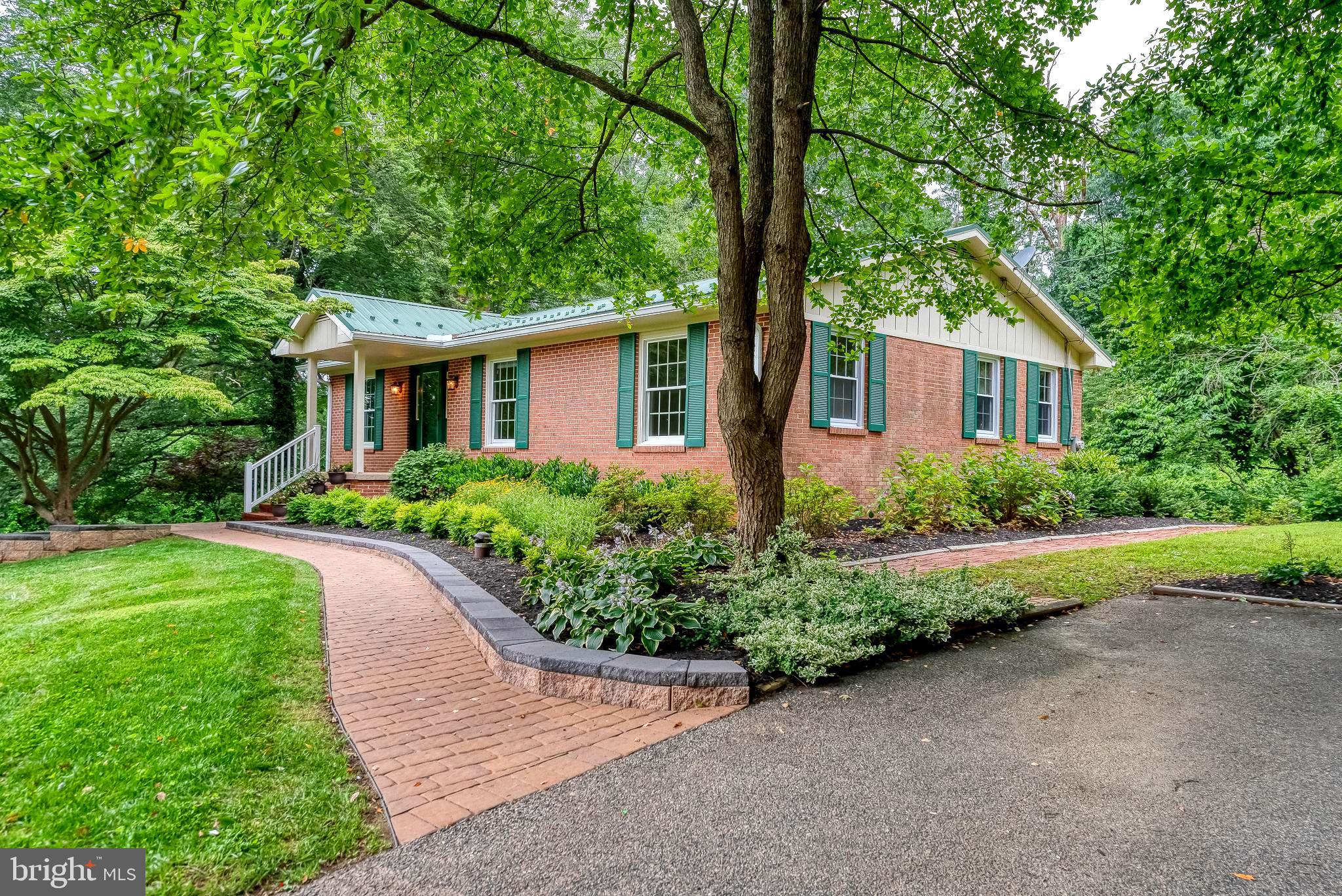You’ll love this charming 3-bedroom, 2-bath brick rancher tucked away on 1.60 private acres in rural Street, MD. Solidly built and move-in ready, this home offers a great blend of updates and character. Recent improvements include a spacious, light-filled family room addition with luxury vinyl plank flooring, and a durable metal roof (installed 10 years ago with a 50-year fade warranty). The property also features newer gutters and downspouts (2022), gorgeous professional landscaping and hardscaping with a small goldfish pond - fish included - for added charm. Inside, you’ll find updated bathrooms, granite kitchen countertops, an induction cooktop, plenty of cabinet space and hardwoods under carpeting. The whole-house generator adds peace of mind, and the screened-in porch with a swing is perfect for relaxing. The walk-out basement includes a flexible space/recreation/hobby room, a bonus room and a laundry room w/utility sink. Come enjoy the beauty of Northern Harford County, local breweries, schools, and Bel Air just 15 minutes away. Bring your ideas to update the kitchen and finish the remainder of basement to truly make this home your own. Home being sold AS-IS.