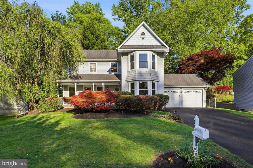 Introducing 625 Sweetwater Dr, a stunning single-family residence inspired by timeless Victorian design, gracefully situated on a quiet, picturesque street in the highly desirable Sweetwater Farm community. Beautifully updated and thoughtfully maintained, this spacious home offers four bedrooms, two and a half bathrooms, and an attached two-car garage, all set on a premium lot with a private backyard retreat.  Step onto the charming covered front porch and into the impressive two-story foyer, where hardwood flooring extends throughout the main level. A sun-filled living room welcomes you to the right, while an elegant formal dining room sits to the left. The foyer flows seamlessly into the open eat-in kitchen, featuring travertine tile flooring and backsplash, soapstone countertops, updated cabinetry, under-cabinet lighting, and a custom range hood.  Adjacent to the kitchen, the inviting family room is anchored by a classic brick wood-burning fireplace and enhanced by beautiful French doors. Step outside to the expansive wood deck and enjoy peaceful mornings with coffee or relaxing summer evenings beneath the gazebo in your private backyard oasis. Completing the main level are a powder room, laundry room, and direct access to the attached two-car garage.  Upstairs, the serene primary suite offers a walk-in closet and a private ensuite bath designed for relaxation, complete with a soaking tub framed by elegant columns, travertine tile flooring, and a separate glass-enclosed shower. Three additional generously sized bedrooms and an updated hall bath complete the second floor.  The finished basement is ideal for entertaining and everyday enjoyment. Gather with friends at the nostalgic 1950s-inspired bar, unwind with a game of pool, or utilize the additional rooms for a private home office, gym, or extra storage.  Conveniently located with easy commuting access and served by the acclaimed Neshaminy School District, this exceptional home offers comfort, character, and lifestyle in one remarkable package.