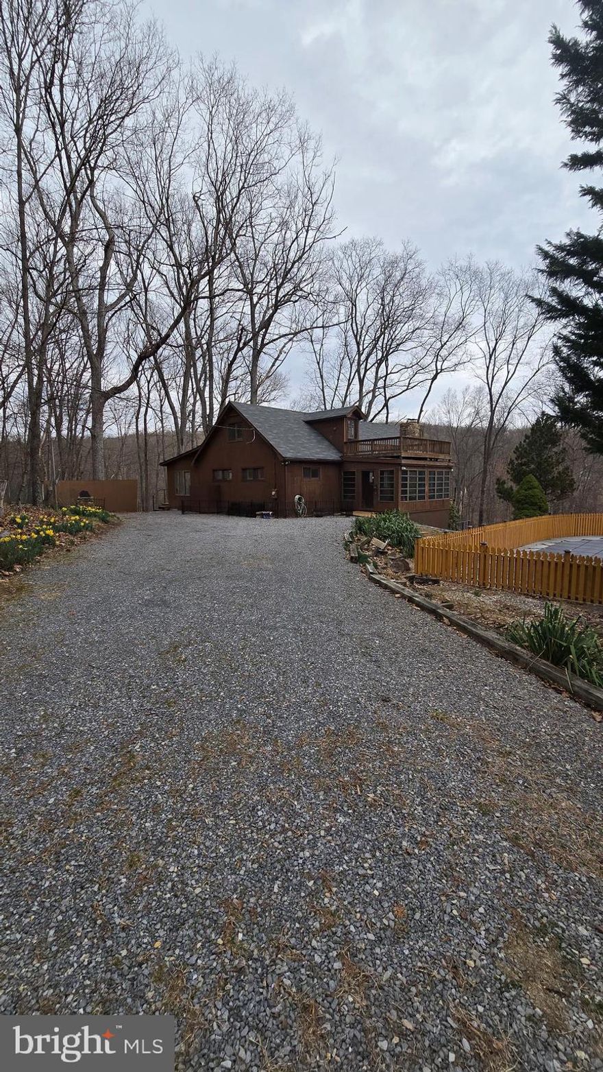 Nestled in a serene, wooded setting, this charming 2-bedroom, 1½-bath home offers the perfect blend of privacy and luxury. Surrounded by lush trees, the property provides complete seclusion while offering breathtaking panoramic views from expansive decks. The open loft space adds a touch of versatility, ideal for a home office, reading nook, or additional living area. Enjoy the sparkling pool, with a $250/month maintenance fee during the pool season, in addition to rent. Whether you're unwinding by the pool or enjoying the peaceful surroundings, this home is an idyllic retreat that combines comfort, nature, and tranquility. Pool house is NOT part of the rental.