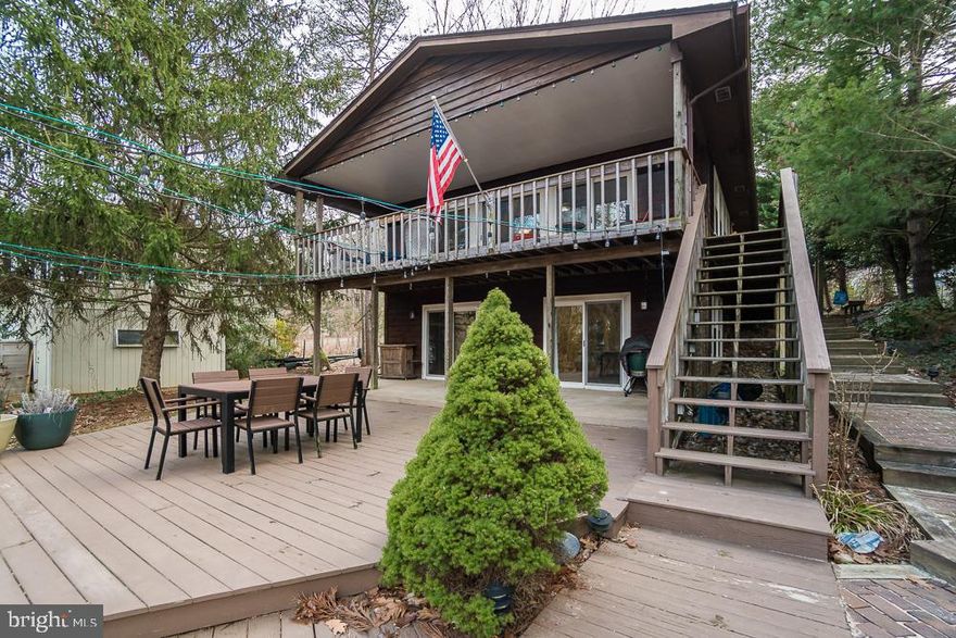 **MAKE YOUR DREAMS OF LIVING ON THE LAKE COME TRUE** THIS  WATERFRONT HOME IS LOCATED ON THE MAIN LAKE IN A WIDE COVE ACROSS FROM ONE OF THE BEACHES---CLOSE TO FRONT GATE AND AMENITIES.     SPACIOUS HOME OFFERS TWO LEVEL LIVING AT ITS BEST.  READY FOR LARGE GATHERINGS WITH 4 BEDROOMS AND THREE FULL BATHS.  UPPER LEVEL FEATURES GREAT ROOM WITH VAULTED CEILINGS, SLIDING GLASS DOORS OVERLOOKING LARGE COVERED DECK WITH VIEWS OF THE LAKE----DINING ROOM , KITCHEN WITH GRANITE COUNTER TOPS AND ISLAND WITH EXTRA SEATING----MASTER BEDROOM WITH EN SUITE AND SITTING ROOM PERFECT TO RELAX IN OR PLENTY OF SPACE FOR AN OFFICE----SECOND BEDROOM AND FULL BATH.FABULOUS  ENTERTAINING AREA IN LOWER LEVEL ---LARGE REC ROOM, GAMING AREA, GAS FIREPLACE, WET BAR , FULL BATH AND TWO ADDITIONAL BEDROOM  (4TH BEDROOM NOT TO CODE)-----LARGE LAUNDRY ROOM WITH PLENTY OF STORAGE  ALL LEADING TO PATIO OVERLOOKING LANDSCAPED REAR YARD.  UPDATES INCLUDE:   ***NEW ROOF DEC  2018*****HVAC****HIGH ENERGY WINDOWS AND SLIDING GLASS DOORS***ENJOY THE WONDERFUL AMENITIES LAKE OF THE WOODS HAS TO OFFER.  TWO LAKES WITH MANY WATER SPORTS SUCH AS FISHING, BOATING, JET-SKIING, TUBING, WATER SKIING, WAKE BOARDING, PADDLE BOARDS OR KAYAKS.   ENJOY FINE DINING AT THE CLUBHOUSE OR A QUICK DRINK AND BITE TO EAT AFTER A ROUND OF GOLF AT THE FAIRWAYS CAFE, TAKE A SWIM IN THE BRAND NEW SWIMMING POOL , CHEER ON THE LOCAL YOUTH AT THE SWIM MEETS, SOCCER GAMES OR SKI CLUB EVENTS , JOIN THE FAST GROWING PICKLE BALL CLUB OR TENNIS CLUB.  .*****LAKE OF THE WOODS AND THIS HOME ARE A MUST SEE******