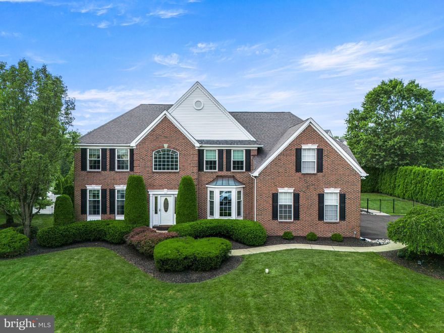 Success has its rewards. From the moment you step past the brick front and through the front door with Baldwin brass side lights into the soaring 2-story foyer, you’ll feel the presence of a house designed for those who expect the best. The renovated kitchen (2024) is complete with soft-close drawers, polished porcelain tile floors, newer appliances, a convenient pantry, and even hand-painted switch plates to match the custom marble backsplash. The island, with generous storage and extra electrical outlets, sets the stage for both refined entertaining and everyday convenience.  The first floor showcases gleaming hardwood floors and a stunning great room with a vaulted ceiling, gas fireplace with remote, and dramatic windows that fill the space with natural light. A versatile bonus room offers the perfect option for a private office, library, study, or even a playroom if your needs dictate. A spacious mudroom with laundry facilities on this floor is designed for an active lifestyle.  Upstairs, all four bedrooms feature extra-large closets. The primary suite, easily large enough for a king-sized bed, is a retreat of its own with a tray ceiling, a large walk-in closet, and an additional space ideal for a sitting room or executive office. The luxurious primary ensuite bath offers a soaking tub, separate shower, linen closet, and two-sink vanity. A well-appointed hall bath serves the secondary bedrooms with a linen closet, two-sink vanity, and a shower/tub combination. Plush carpeting extends across the stairs, hallway, and bedrooms for comfort.  The expansive basement, with high ceilings and abundant light, offers exceptional potential to create the living or entertaining space of your dreams. Thoughtful upgrades, such as a new HVAC system, newer roof, and replacement windows throughout, ensure comfort and peace of mind. Additional features like a Ring camera system, exterior walkway lighting, and a whole-house generator further elevate both security and convenience.  Outdoors, enjoy the serenity of a fully fenced backyard with a paver patio, ideal for private gatherings or lively entertaining. A brand-new driveway enhances both function and curb appeal, while the professionally landscaped half-acre property provides distinction and privacy. A side-entry two-car garage, finished with epoxy flooring, insulated garage doors, and automatic openers, adds both convenience and style.  This special property reflects accomplishment and forethought, and is ready for its next discerning owner. Schedule your private showing today.