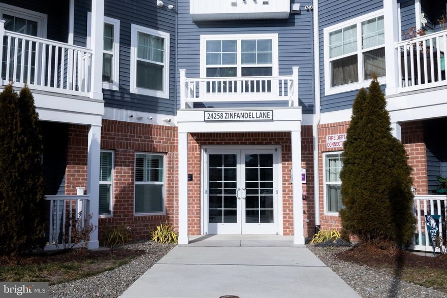 Agent Bonus!!!
Experience effortless coastal living in this beautifully appointed first-floor condominium located in the highly sought-after community of The Vineyards of Nassau Valley. Perfectly positioned to capture peaceful partial lake views, this inviting home offers the ideal blend of comfort, style, and convenience in a serene, resort-like setting. The only unit with its very own sidewalk.

Step inside and immediately feel at home with luxury vinyl plank flooring flowing throughout the main living areas and a fresh, modern color palette that enhances the light-filled open floor plan. The stunning kitchen is truly the heart of the home, featuring granite countertops, striking deep blue cabinetry, stainless steel appliances, gas cooking, and a spacious pantry. A breakfast bar provides additional seating, while the adjoining dining area creates the perfect space for everyday living or casual entertaining.

Designed for connection and comfort, the open layout allows seamless flow between the kitchen and living spaces. The living room is filled with natural light and framed by windows showcasing calming pond views. Step outside onto the covered porch a perfect retreat for morning coffee, evening unwinding, or simply enjoying the peaceful waterfront scenery.

The spacious primary suite offers a private sanctuary with an en suite bath highlighted by an extra-wide shower designed for comfort and ease. A second bedroom provides flexibility for guests, hobbies, or a home office, complete with its own partial lake views and convenient access .  A dedicated laundry room with a full-size stacked washer and dryer adds everyday practicality.

Residents of The Vineyards of Nassau Valley enjoy an amenity-rich lifestyle featuring a beautifully appointed clubhouse with fitness center and billiards room, a sparkling outdoor pool, Lakeview Terrace with fire pit and grilling areas, fishing pier at Lake Harmony, dog park, walking trails, picnic areas, volleyball and pickleball courts, horseshoes, and direct access to the Lewes-Georgetown Trail.

Ideally located just steps from Redner’s Market and Nassau Valley Vineyards, and only five miles from the beach, this home offers exceptional access to shopping, dining, entertainment, and coastal recreation. With convenient access to Route 9 and Coastal Highway, everything you need is within easy reach.

This move-in-ready condo presents an exceptional opportunity to enjoy low-maintenance living while embracing the relaxed coastal lifestyle that makes The Vineyards so desirable. Schedule your private showing today and discover why this home is the perfect place to call your own.