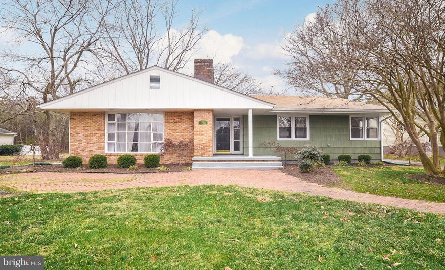 Located in Leonardtown City limits. 3 bedroom 2 bath.  Mature trees, brick pavers, detached garage  with workshop. Home features hardwood floors, built ins, fireplace and sunroom. Must see to appreciate . Located at the end of a street. Backs to trees.  Lovely landscaping.
