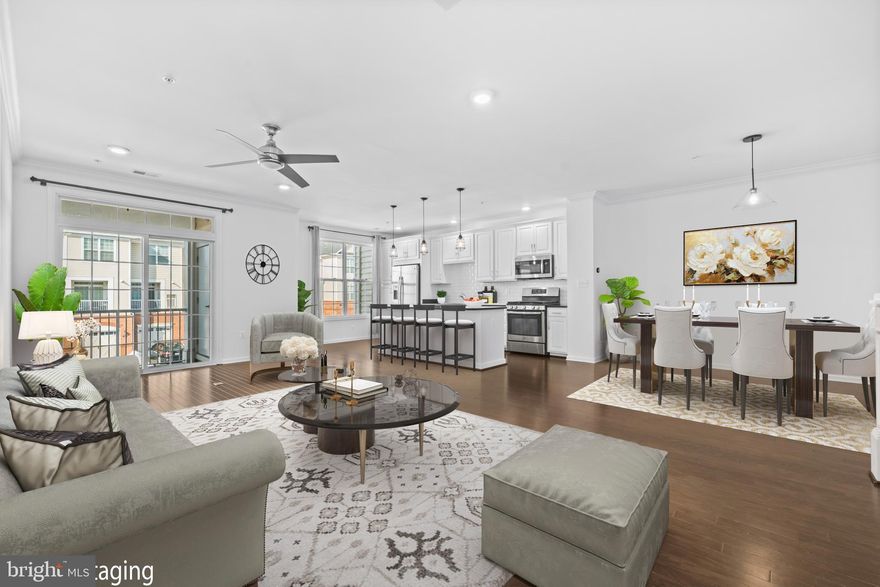 Welcome to this  charming 2 bedroom, 2.5-bath Toll Brothers condo with an attached one-car garage.

Built by Toll Brothers, this home offers exceptional quality and thoughtful design throughout. The open-concept great room showcases beautiful hardwood floors and provides access to a covered porch — perfect for relaxing or entertaining.

The spacious kitchen is truly the heart of the home, featuring crisp white cabinetry, granite counter tops, backsplash, a large center island with pendant lighting, a pantry, and ample prep space for any home chef. A convenient powder room completes the main level.

Upstairs, the primary suite offers a private retreat with an en-suite bath and a walk-in closet outfitted with custom Elfa shelving and organizers. The secondary bedroom also features a custom Elfa-fitted walk-in closet and is served by a full hall bath. For added convenience, the washer and dryer are located on the bedroom level. Hardwood flooring continues upstairs, adding warmth and continuity.

Additional highlights include a long driveway accommodating two cars, ceiling fans, and freshly painted walls throughout.

Ideally situated between Brambleton Town Center and the Ashburn Metro Station, this home offers easy access to shopping, dining, and major commuter routes. Residents enjoy a beautifully landscaped community with resort-style amenities including three clubhouses, pools, party rooms, fitness centers, basketball and tennis courts, and scenic walking trails.

Close to Dulles Airport and major commuting routes — don’t miss this opportunity.