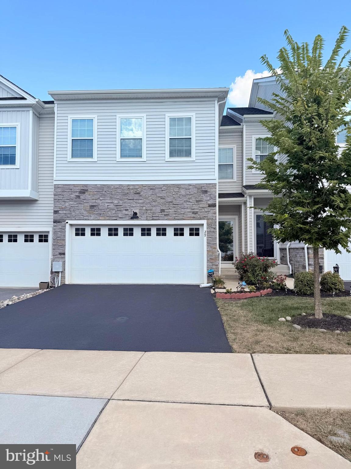 Rental available from Nov 25, 2025. Welcome to your stunning middle unit carriage home in Lochiel Farms! Built in 2021, this property blends the charm of new construction with immediate move-in readiness. With over 2,340 square feet living space and 700 sq ft finished basement, this spacious home features 3 bedrooms, 2.5 bathrooms, a two-car garage. Easy access to the PA Turnpike, Routes 202 & 100, Marsh Creek State Park, train stations, shopping, dining, Chester Valley Trail and East Whiteland Park, perfect for outdoor recreation. Main floor has open floor plan with fully upgraded kitchen highlighted by an oversized quartz island, stainless cooktop with a sleek range hood, and quartz countertops throughout. Designed for both style and function, the kitchen includes soft-close drawers, ample cabinetry, a built-in oven and microwave, and a walk-in pantry. Adjacent to the kitchen, the open gathering area offers a cozy sitting area, dining space, and living room with a gas fireplace and remote control. Sliding glass doors open to a Trex deck, ideal for outdoor dining and relaxation. The second floor features expansive master's suite with walk-in closet and a sitting area, and an elegant bathroom with double sinks, a large shower stall, and a separate commode. Two additional bedrooms, each with walk-in closets, share a full bath, while a convenient laundry room completes the second floor. The large basement fully finished for gatherings and entertainment with high ceilings and an egress window. Additional home features include recessed lighting, security system, ceiling fans, finished garage, water softner. Don’t miss this exceptional home in one of Chester County’s most desirable communities - schedule your tour today!