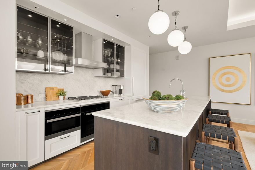 INCENTIVIZED PRICING - JUST REDUCED FROM $900,000!! BRAND NEW ONE-BEDROOM CORNER UNIT WITH BALCONY AVAILABLE!
Welcome to the Four Seasons Private Residences in Harbor East, where luxury meets lifestyle in Baltimore’s most coveted waterfront address. This stunning one-bedroom, one-and-a-half-bathroom corner unit w/ balcony was thoughtfully designed to utilize every inch with purpose, so it lives larger than 1,222 sq ft! Step into an atmosphere of sophistication with soaring ceilings, rich walnut chevron-patterned flooring, and designer finishes throughout. Expansive floor-to-ceiling windows bathe the home with natural light while showcasing views of the city skyline and Inner Harbor. The gourmet kitchen is a chef’s dream, outfitted with Miele appliances, sleek Eggersmann soft-close cabinetry, luxurious marble stone countertops, and a built-in Sub-Zero wine fridge - perfectly blending timeless elegance with modern function. The primary suite is a tranquil sanctuary, offering a custom-built walk-in closet for optimal storage and a spa-inspired, marble-clad en-suite bath featuring a double vanity with designer finishes, and a glass-enclosed walk-in shower with a built-in bench and niche, inviting total relaxation. A spacious powder room provides added comfort and privacy for guests, and the home is enhanced throughout by motorized window shades and thoughtfully selected lighting.

The Four Seasons Private Residences Baltimore offers a turn-key elevated lifestyle. As a resident, you'll enjoy a private entrance where you will be met by our full service concierge and on-site building manager to assist with your every need, as well as exclusive access to the sprawling 28th-floor amenity level, where world-class services meet resort-style indulgence. Amenities include an indoor heated saltwater infinity-edge pool, state-of-the-art fitness center, sauna, coffee station, billiard room, and numerous elegant gathering spaces. Multiple rooftop decks offer panoramic city and harbor views, complete with indoor and outdoor fireplaces, a grilling station, a dining area, and a kitchen, all ideal for entertaining. Completing this unparalleled lifestyle experience are a fully equipped conference room and a dedicated AstroTurf dog-walking area. This residence offers the rare opportunity to live within a full-service, hotel-branded building while enjoying the privacy and sophistication of a true luxury home. All set within steps of Harbor East’s acclaimed restaurants, shopping, and the waterfront promenade. This is a MUST SEE ONE BEDROOM!! Immediate occupancy is available. Come see what all the fuss is about! 

*Photos are from our sales office which is a model of the same exact floor plan*