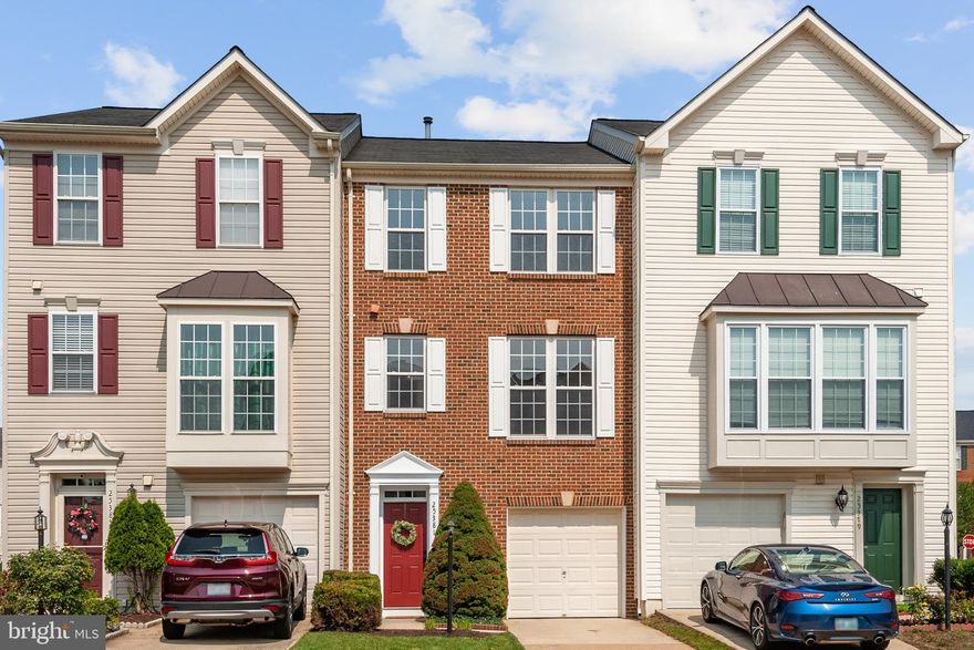 Truly move-in ready!  This generous townhouse features a three-level bump out providing the interior not only value-added square footage but a sense of space magnified by high ceilings and natural light.  Smart upgrades, just finished, include ALL levels of fresh paint, NEW carpeting, and NEW kitchen appliances! 
 The attention to detail is evident in the updated lighting and hardware throughout, which adds a modern touch to every room.  The entry-level has access to the attached garage, providing the ultimate convenience for parking and storage.  In addition, the huge windowed recreation room, with a direct walkout to the backyard, offers versatility and endless options.  There is plenty of space for TV/media, fitness, playroom, or office.  Upstairs, the main level, finished in light-toned REAL hardwoods, is bright and open to seamlessly integrate daily life.  The living room blends with a more formal dining room set within striking architectural columns.   The kitchen, breakfast, and family areas are designed to mimic a "great room" layout.  From the brand-new never-used stainless kitchen appliances to the gas fireplace focal point in the family room, here is an inspiring and functional space for everything from eating to entertaining. 
 Relax and unwind on the sun deck with stairs down to the expansive fenced backyard, a rare find for townhouse living.   Both are perfect places to host al fresco gatherings and enjoy outdoor fun.  The primary bedroom is a true retreat, featuring an en-suite bath with a luxurious soaking tub and a separate shower.  Two secondary bedrooms share a modern hall bath with a tub/shower.  The Kirkpatrick Farms community is packed with amenities! Enjoy access to a variety of recreational facilities, such as a swimming pool with a clubhouse, sport courts, and playgrounds.  Scenic parks with gazebos, picnic tables, and water features are dotted throughout the community. There’s a RushBus bus stop that runs weekdays direct to the Loudoun Gateway Metro Station.  Ready for the perfect blend of comfort, style, and convenience? Schedule a showing today.