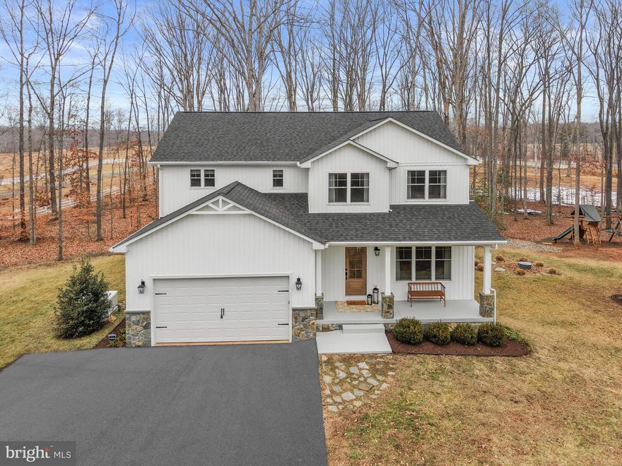 Experience the perfect blend of beauty and comfort in this exceptional Craftsman-style home built in 2021. Beautifully situated on 2 serene acres with the backdrop of picturesque farmland and galloping horses, this residence offers peaceful country living at its finest.  

Upon entry, a striking two-sided stone fireplace welcomes you, serving as a warm focal point that anchors the formal living spaces. Gorgeous wide plank hardwood floors flow graciously throughout the main level and upper hallways, enhancing the home’s timeless classic design.

The gourmet kitchen is a chef’s dream, boasting white cabinets, elegant backsplash, farmhouse sink, large island, and a walk-in pantry. The light-filled dining area opens seamlessly to a spacious sitting room with sliding glass doors that lead to the deck and stone patio—perfect for indoor-outdoor entertaining while enjoying landscaped gardens and tranquil countryside views.

Upstairs, generously sized secondary bedrooms are complemented by a beautifully appointed hall bath with dual sinks and custom vanities. No details are overlooked in the luxurious primary bedroom retreat, complete with a large walk-in closet and spa-inspired ensuite bath featuring a freestanding soaking tub and custom tiles.

The expansive finished walk-out basement is an entertainer’s dream, offering abundant open space and a convenient full bathroom—ideal for recreation, guests, or extended living.


Enjoy breathtaking sunsets, peaceful evenings, and cozy campfires in this idyllic setting—all while being just minutes from everyday conveniences. A rare opportunity to experience refined country living in a nearly new, model-like home.