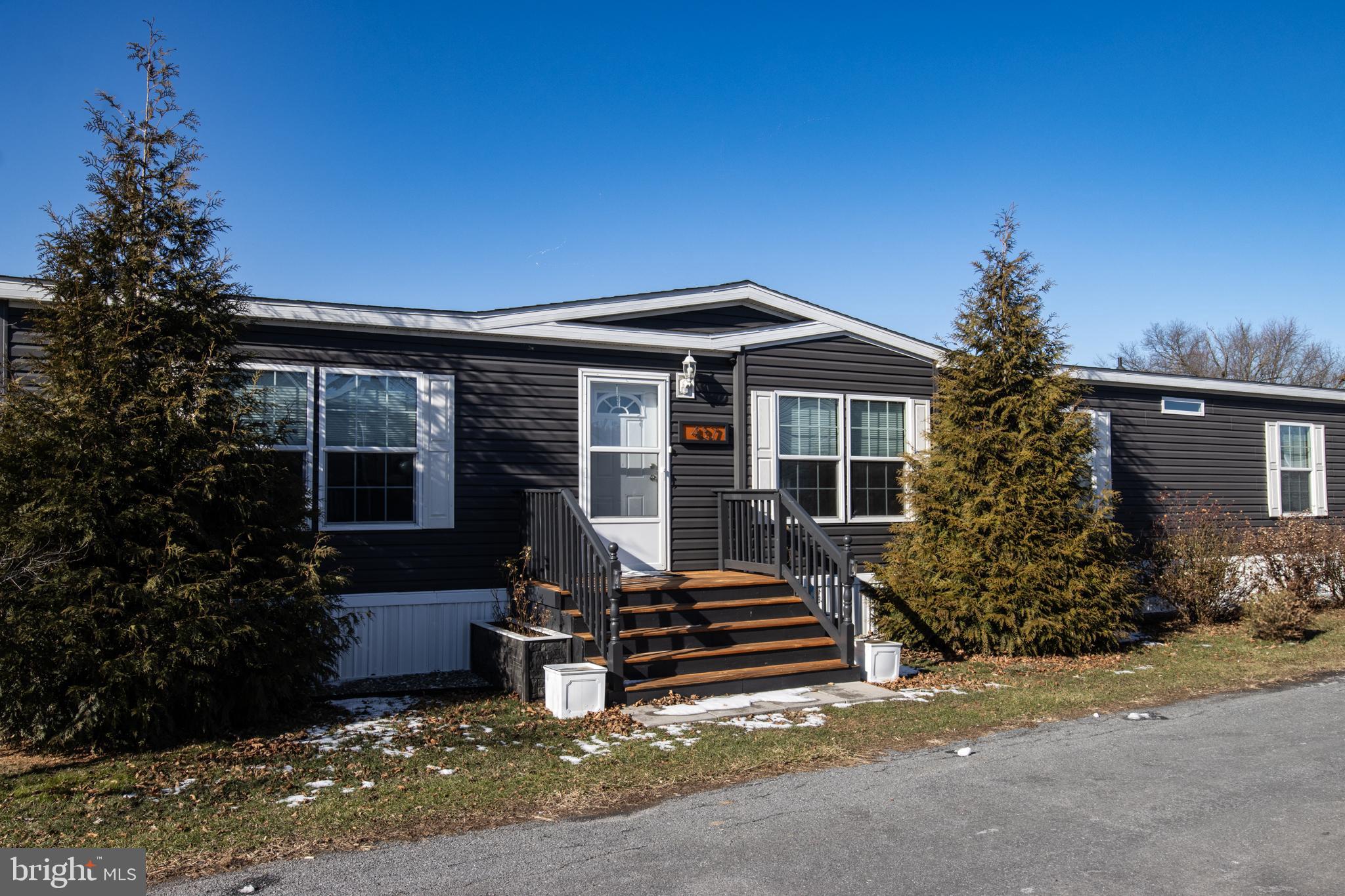 Back on the market do to no fault of the home! Come explore this stunning manufactured home, featuring numerous upgrades throughout. With 4 spacious bedrooms and 2.5 bathrooms, this home offers over 2,000 sq. ft. of living space, providing plenty of room to spread out. The massive master bath includes a beautifully tiled walk-in shower. Enjoy outdoor gatherings on the solid side deck, complete with a grill that can stay for your cookouts. For added safety and durability, architectural shingles and an ice guard have been installed.
