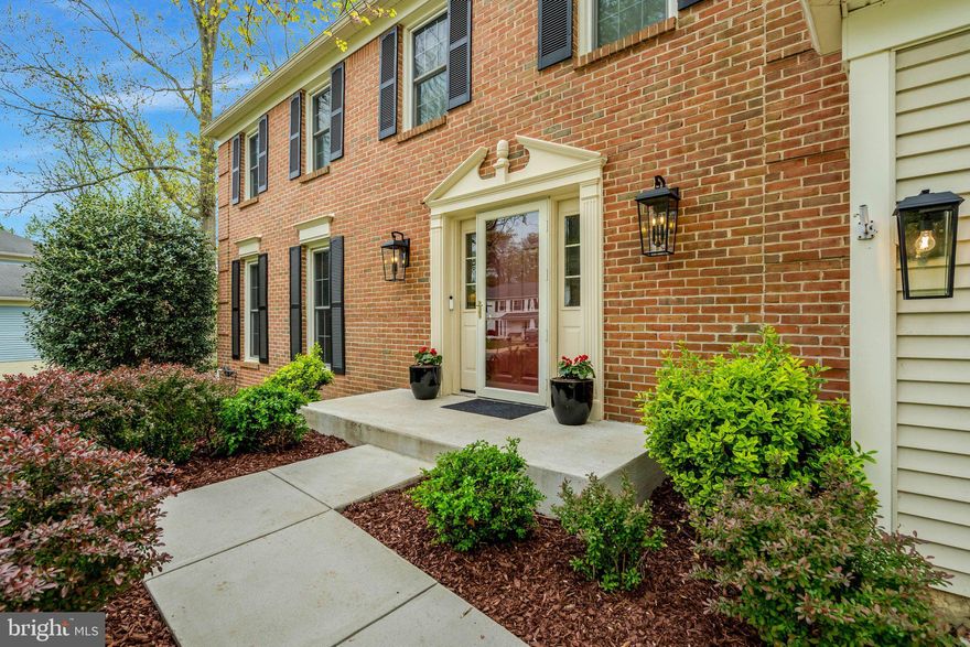 This is the one you've been waiting for! A Burke Centre model home completely transformed with designer finishes from top to bottom — and it's move-in ready. From the custom coffee bar and 5x10 kitchen island to the shiplap built-ins and full smart-home package, every detail has already been taken care of for you. Step inside to new hardwood floors and board-and-batten accents, where the showstopping kitchen sets the tone for the entire home — featuring custom cabinetry, a 5x10 island, and a coffee bar with direct access to the large screened-in porch and deck, perfect for entertaining. The redesigned dining room with a gas fireplace adds warmth and elegance, while the living room built-ins with shiplap accents add character throughout. Designer front porch lights and mature hydrangeas create stunning curb appeal. The home also showcases new trim on the main level, featuring tall baseboards complemented by wide, flat window trim with strong architectural lines that create timeless, upscale elegance. The main level also includes a laundry/mud room with a wet sink off the oversized 2-car garage and a half bath for everyday convenience. Upstairs, you'll find the primary bedroom with an ensuite bath, 3 additional bedrooms, and a conveniently located full bath. The fully finished basement features a full bath, wet bar area, and a large storage room that could be converted into a bedroom if desired. Smart home features include Google Nest cameras, a Google Nest thermostat connected to the brand new HVAC (July 2025), ADT alarm system on doors and windows, and a Bluetooth garage door opener. The well-manicured yard is served by an in-ground sprinkler system, and a Frontline Pest Control bait station system is under contract through March 2027. HOA amenities include multiple pools, playgrounds, and miles of community trails throughout Burke Centre. Homes like this don't last — schedule your showing today!