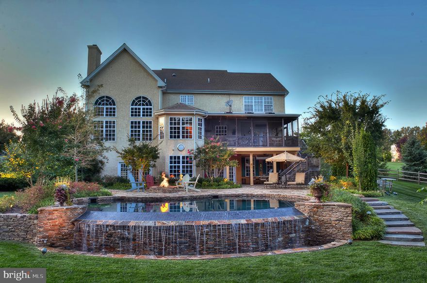 Be ready to be WOWED by this stunning home located in the cul-de-sac neighborhood of Middleton Greene. This beautifully maintained home has an open floor plan with 4 bedrooms, 4.5 baths, gourmet kitchen, double story family room, home office, hobby rooms, screened porch and a large finished walk-out lower level. This home is professionally landscaped and features an amazing heated infinity salt water pool w/ waterfall, stone patio, built-in fire pit, and an outdoor kitchen. You'll feel as though you're on vacation every day! Perfect for entertaining your family and friends. As you enter the front door, you are greeted with a two-story foyer with gleaming hardwood floors. To the left is the living room with a bay window that opens into the large dining room that has an atrium door that leads to a gorgeous screened porch overlooking the professionally landscaped yard w/ infinity salt water pool. The heart of the home is the large gourmet kitchen w/ white kitchen cabinets, quartz counters, tile backsplash, large island with storage and bookcase, double ovens, built-in microwave and a large walk-in pantry. There is an oversized breakfast room w/ vaulted ceiling, skylights and sliding doors that lead out to the screened in porch. The expansive screened porch overlooks the park-like backyard has ceiling fans, sky lights and is perfect for evening diners or morning coffee. A breakfast bar overlooks the large family room w/ Palladian windows and a custom floor to ceiling stone wood burning fireplace w/ built in wood storage.  If you work from home you'll love the home office with custom built-ins, built in desks with plenty of storage and file drawers.  There is also a large flex space/ playroom next to the office and 1st floor powder room that could easily be converted to a 1st floor bedroom. If you have pets, you'll love the laundry room with a dog friendly shower.  Yes, this house truly has everything!  The second floor offers a huge primary bedroom w/ tray ceiling, sitting room, his and her closets w/ custom built-ins.  The large primary bathroom has a tile shower, double sinks, soaking tub, linen closet and a toilet room. There are three additional bedrooms that all have large closets with built-ins. The 4th bedroom is an ensuite and features a full bath and a walk-in closet.  Hall linen closet, window seat nook and backstairs that lead back to the kitchen/family room complete this level. The fully finished walk out lower level with large windows adds an extra 1,800 square feet to this expansive home!   It has multiple recreation areas, full bathroom, a TV area, butler/ kitchen pantry room with sink, hobby/studio room and a storage area. The lower-level walks out to the MAGNIFCENT very private backyard which features extensive professional landscaping, stone hardscaping, outdoor night lighting, covered and heated outdoor kitchen with sink, ice maker, grill area and warming oven.  A master griller dream kitchen!  And let's not forget the lagoon style salt water pool with infinity edge, stone coping and waterfall.  This natural pool has a Pebble Tec finish to create a pond look. Built in fire-pit and split rail fence with wire mesh around whole yard completes this oasis. This home and outdoor space is difficult to duplicate in today’s market! Three zone heating & cooling, tankless hot water system, roof 2020, Stucco inspected with no issues, new carpet in bedrooms, freshly painted, 2- car garage w/ epoxy floor, built in shelving above doors.  Easy access to Wilmington DE, Longwood Gardens, Kennett Square and the I-95 corridor.