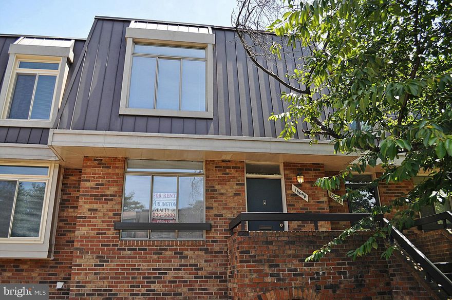 Prime Location - urban living at it's finest. 3 blocks to Metro, Pentagon City Mall upscale shopping & restaurants. Eat-in upgraded kitchen with Corian countertops, ceramic tile floor, newer appls. Expansive living/dining room offers woodburning fireplace - walks out to balcony. 2 master suites with privates baths. Washer & dryer. Lots of closet space. 1 reserved pkg. spot. 1 unreserved space.