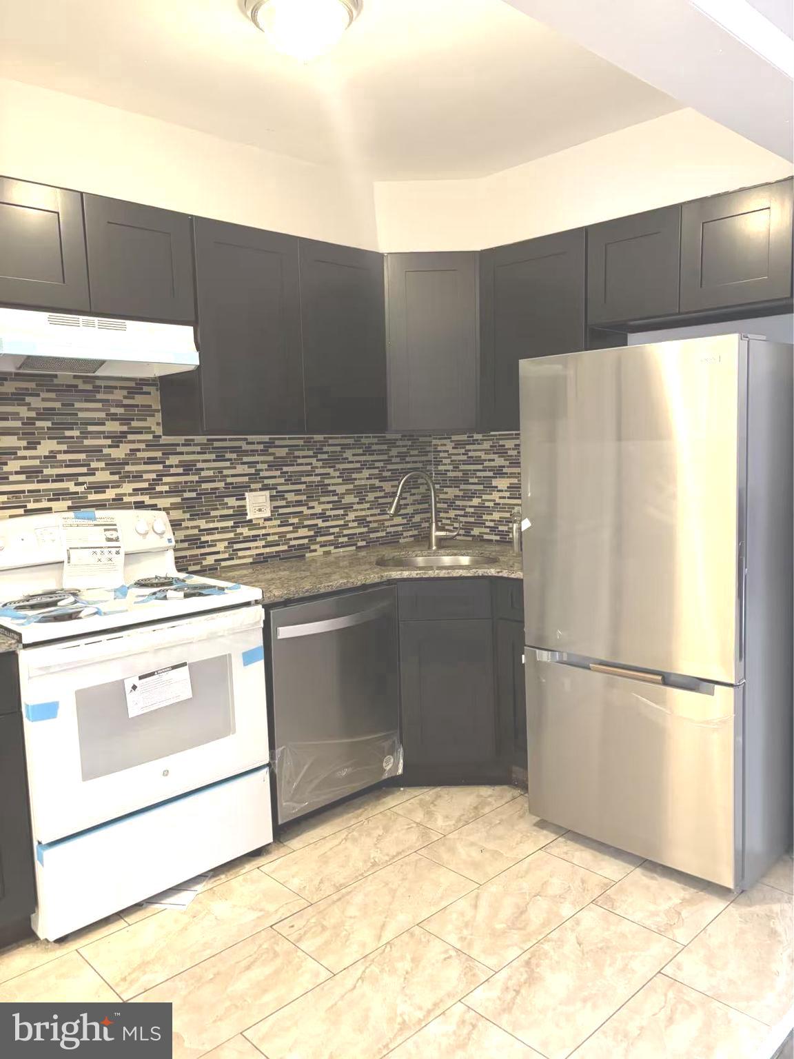 Welcome to this recent renovated stunning Rowhouse in the NORTHWOOD neighborhood. This is such a convenient location, with the Market/Frankford El station just blocks away. Step into the living room you will see beautiful new waterproof woody flooring guide you to the gorgeous kitchen, brand new cabinets and countertop. Upstairs offers 3 nice-sized bedrooms with fresh new paint room to room . Huge Giant Extra Large Rear Yard Great for Family gatherings, BBQ, or could be a garden for your enjoyment.