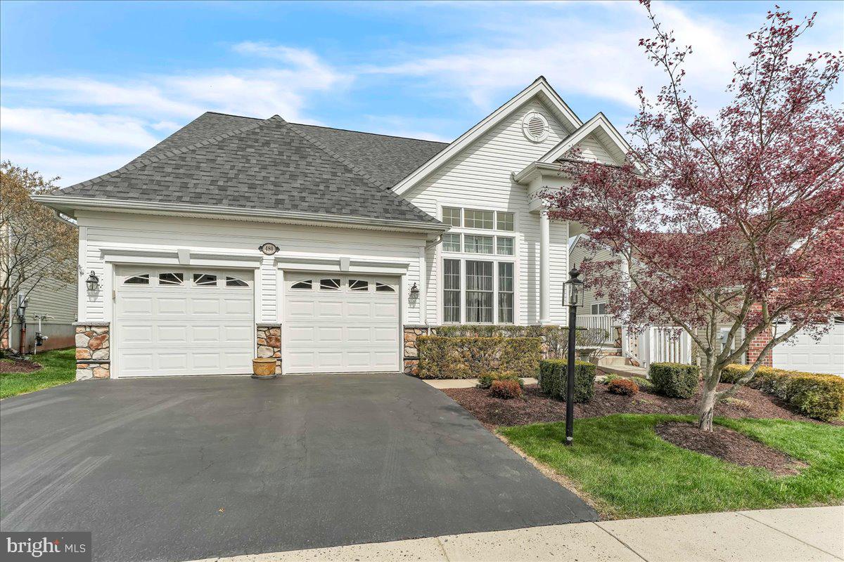 Welcome to the Narberth Model home in Regency at Providence, a vibrant 55+ community conveniently located near Providence Town Center, the Oaks shopping area and charming downtown Phoenixville. This popular model boasts a two-story living room and dining room with walls of windows, hardwoods and a turned staircase leading to the second-floor loft. The gourmet kitchen is a culinary haven, abundant cabinets and a wrap-around raised counter, perfect for casual dining. Adjacent to the kitchen, the extended eating area seamlessly flows onto the elevated deck, offering a serene retreat for leisurely reading or enjoying morning coffee. The premium lot backs up to trees and you will not be disappointed by the array of colorful birds should you decide to put a bird feeder off your deck. The great room is a focal point of this home showcasing a gas fireplace complemented by expansive windows. The owner’s suite is located off the great room with a deep walk-in closet and a deluxe bathroom featuring a standing shower with seating, double sinks and wraparound counter specially designed by the owners. A second bedroom, full bath and first floor laundry are located on this level. The second level loft overlooks both the great room and living room/dining room areas, providing an inviting space for guests, an office or a crafting/hobby area. A third bedroom and full bathroom as well as a large storage closet complete this level. This home is further enhanced by a fully finished basement with a walk-up staircase to the back yard. The oversized recreation room is an ideal setting for relaxation and entertainment. The owners added a half bath to this level and a large storage/utility room, complete with shelving. They have thoughtfully added ceiling fans, recessed lighting, installed a Generator, and battery backup sump pump. A monthly calendar of events is provided for your convenience along with a listing of items covered by the monthly association fee. Each home has a standing light post and mailbox in front of the home. Security gates close at 10pm and open at 6:30am, streetlights and sidewalks are just some of the additional features of this award-winning 55+community close to Rt 422, King of Prussia and Valley Forge Park.