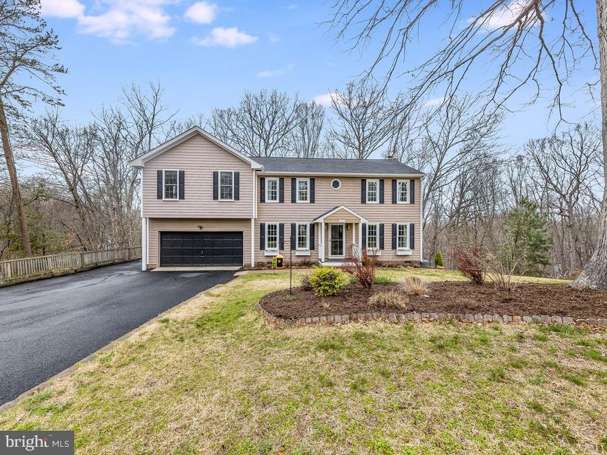 UPDATED 4BR, 3.5BA, 2 Level Colonial on Cul-De-Sac and is Move In Ready! ***Veteran Assumable 3.25% VA Loan***Highlights and Features Include: Hardwood Flooring(2020) Throughout The Main Level; Foyer w/Insulated Entry Door w/Keyless Door Lock; Living Room & Dining Room w/Hardwood Floors; Family Room w/Chair Rail & Fresh Lined Wood Burning Fireplace(2021) w/Brick Hearth & Surround, Atrium Glass Doors to Rear Deck; Up To Date(2022) Kitchen with Quartz Counters, Stainless Steel Appliances, Energy Efficient Dishwasher(2021) & Fridge(2022),  Bead boarded Island w/Quartz Counters & Breakfast Bar, & Ceramic Tile Backsplash; Laundry w/Ceramic Tile Flooring, Shelves & Door to Two Car Garage; Main Level Half Bath w/Vanity w/Storage & Ceramic Tile Floors Complete The Main Level. The Upper Level Features Primary Bedroom w/TWO Walk In Closets, Ceiling Fan w/Light, Carpet, & Window Treatments; Attached Primary Bath w/Two Granite Vanity w/Storage, Water Closet, WHIRLPOOL Jetted Tub w/Ceramic Tile Surround, Stand Up Shower w/Floor to Ceiling Tile w/Inlays, Tile Basin & Bench & NEW MOEN Shower System(2022); Bedroom 2, 3, & 4 have Carpet & Closets; UPDATED(2019 & 2020) Hall Full Bath 2 & 3 w/Tub/Shower w/Ceramic Tile Surround & Vanity w/Storage Complete the Upper Level. Additional Highlights Include Fully Fenced Rear Yard; SPACIOUS Rear Deck w/Stairs To Grade; Conveying Shed & Firepit; LARGE Paved Driveway w/Additional Parking Pad for Trailer/Boat/RV; Dual Zoned TRANE HVAC; Double Pane - Tilt In Vinyl Windows (2019) & Roof with 3-Tab Shingles(2021). Aquia Harbour Amenities include: Two Pools; State Certified Police Force; Fire Dept; Marina w/Boat Ramp & Fishing Pier; Kayak/Canoe Launches; Golf Course w/Pro Shop, Putting Green, Driving Range & the World Famous Clubhouse @ Aquia Harbour Restaurant; Dog Park; Horse Stables, Riding Areas/Trails & Pens; Secure Storage Lot; Community Garden; PreSchool; Fishing Park; 8 Other Parks w/Tot Lots, Tennis, Basketball & Abundant Wildlife Including Bald Eagles in the Sky Above! The Harbour also features Great Community Events including Independence Day Celebration w/Fireworks, Oktoberfest, Movie/Game Nights and So Much More!!!! This Home is only ONE Minute from Aquia Harbour Back Gate and an EASY Commute to Quantico!  **Offer Submissions Prior To and Over the Weekend Need to be Received by Monday Night 4/10 for Review and Response on Tuesday 4/11**