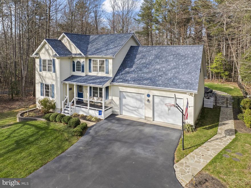 Beautifully updated and meticulously maintained by the original owners, this three level home has so much to offer plus an incredible backyard retreat!
Inside, you’ll find a light-filled, airy layout with southern exposure and sunlight throughout the day. Not your average floor plan-this home features a two-story entry with a thoughtfully positioned staircase tucked just around the corner off the family room for a clean, open feel upon entry.

The main level offers a spacious family room open to an updated kitchen with stainless steel appliances, granite countertops, tile backsplash, and dining area—perfect for everyday living and entertaining. A dedicated office, flexible bonus space, and convenient half bath add to the functionality. Step outside through the slider to your private backyard oasis featuring a multi-level Trex deck with outdoor lighting, on ground pool, fully fenced yard, wooded backdrop for added privacy, and storage shed.

Upstairs, the primary suite showcases new luxury plank flooring, a private balcony, and a beautifully renovated ensuite bath with soaking tub, separate tiled shower, dual vanity, water closet, and a walk-in closet with organizer. The upper level also includes a brand-new hall bath, a dedicated laundry room, and three additional bedrooms—including an oversized bonus room with walk-in closet over the garage.

The finished lower level offers a large recreation room, fifth bedroom, full bath, and abundant storage, with walk-out access to the backyard.

Situated on a quiet street with no HOA, this home features a paved driveway with ample parking, an oversized two-car garage, hardscape details including a flagstone walkway, front retaining wall, and a welcoming covered front porch.  Additional highlights include dual HVAC systems for efficient comfort, water softener system and two electrical panels. 
Conveniently located with quick access to Route 4 for commuting to PAX Naval Air Station, Dominion, and Calvert Cliffs. Enjoy nearby parks with ball fields, pickleball courts, dog park, playgrounds, water park, and golf course. Just minutes to Solomons Island for waterfront dining, boardwalk strolls, and entertainment.