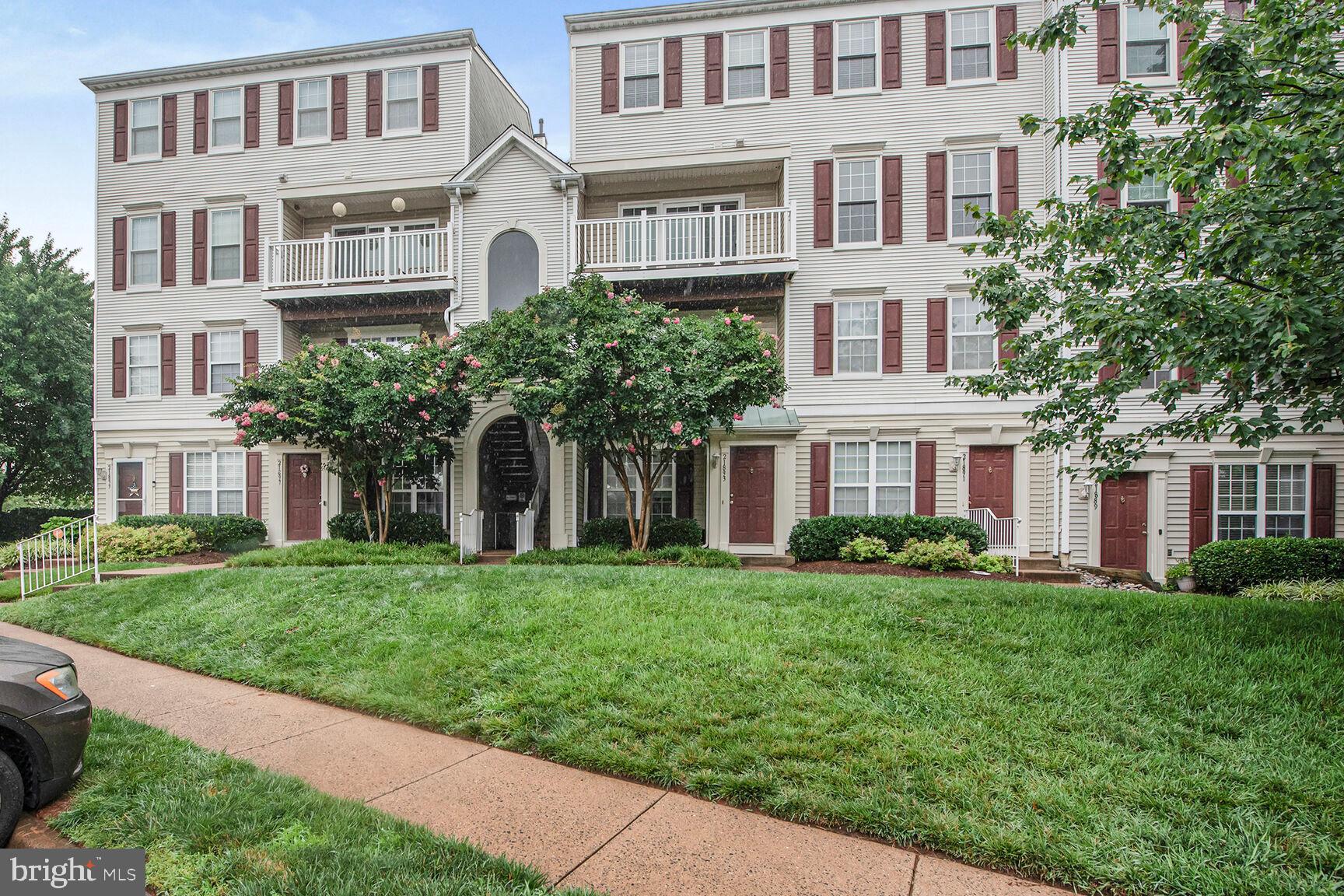 Welcome to this stunning 2-bedroom, 2.5-bath penthouse condo in the sought-after Dominion Station community! With over 1,200 sq ft of stylish and comfortable living space, this light-filled home features upgraded flooring on the main level, brand-new carpet upstairs (2025), and fresh paint throughout. The main level offers an open-concept layout where the living and dining rooms share a cozy three-sided gas fireplace—perfect for both relaxing and entertaining. The gourmet kitchen is a chef’s dream, complete with sleek quartz countertops, stainless steel appliances, gas cooking, and white cabinetry. A convenient powder room is also located on the main level. Step out onto your private balcony with peaceful views of the community clubhouse and pool—ideal for morning coffee or winding down in the evening. Upstairs, you’ll find two spacious bedrooms, each with walk-in closets and private ensuite baths. The luxurious owner's suite features a spa-like bath with dual-sink vanity, soaking tub, and separate stand-up shower. The laundry closet is also conveniently located on the bedroom level. Enjoy a pet-friendly community with access to playgrounds, walking paths, pool, and more. This home includes one assigned parking space and ample visitor parking. Condo fee includes water/sewer, snow and trash removal, community amenities and common area maintenance. Located just minutes from Wegmans, Dulles Airport, the Silver Line Metro, golf courses, an ice skating rink, multiple parks, and all of the shopping and dining options in Dulles and Reston Town Centers, this beautifully updated penthouse condo offers the perfect blend of comfort, convenience, and lifestyle. Don’t miss this!