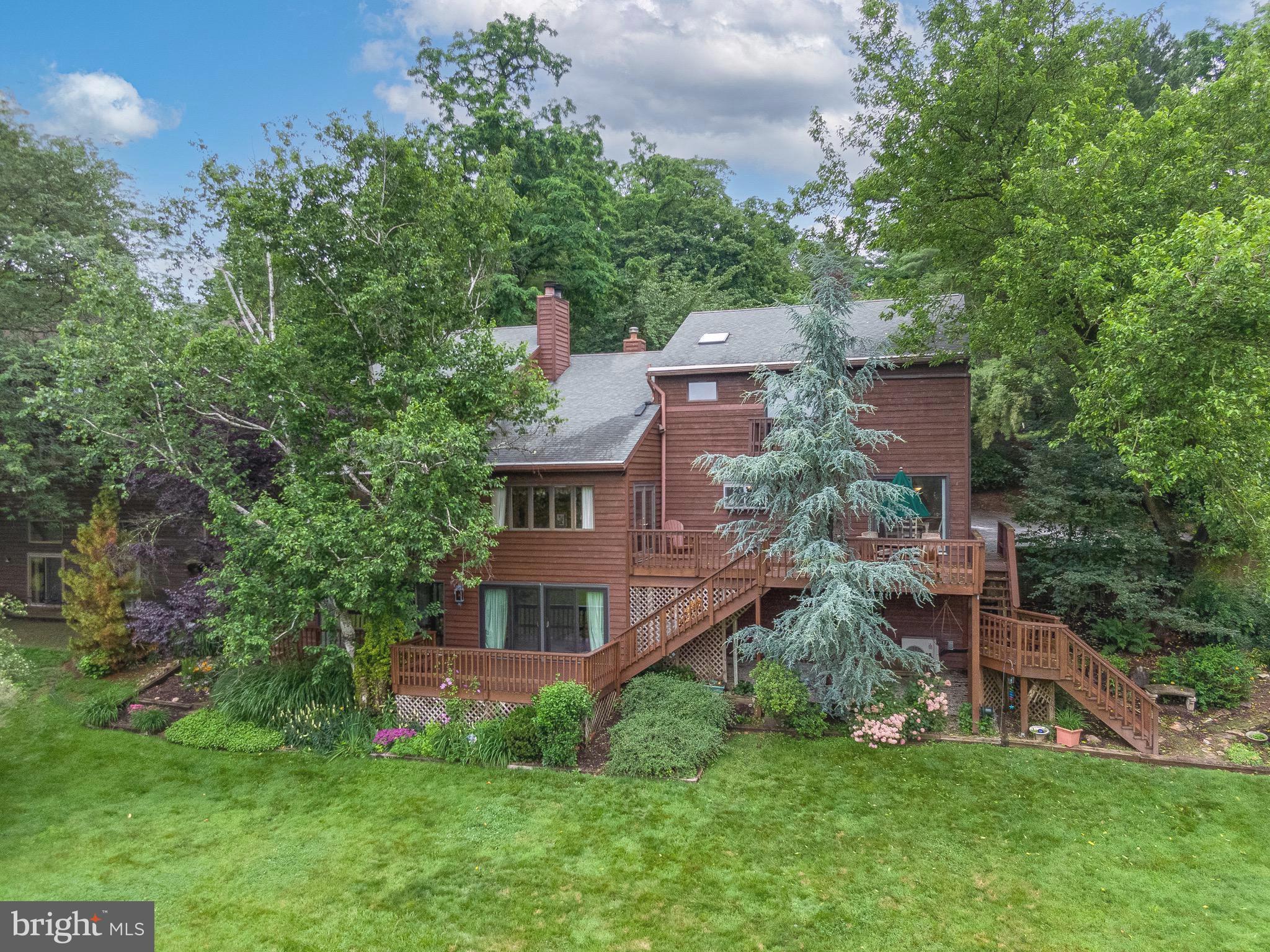 Welcome to this extraordinary Contemporary home at 16 Golfview Ln along the 13th fairway of the Reading Country Club golf course. This idyllic setting gives you plenty of space to relax and enjoy nature and watch the golfers pass on by. Surrounded by beautiful landscaping and expansive views this home offers so much more than many others. As you enter you immediately feel the warmth and coziness of this home. Though this home is over 4,200sqft it feels intimate from the two main floor offices each with their own separate entrances and the family room area with windows allowing so much natural light, to every other room in this home. The large kitchen has all the amenities you would like including a gas(propane)cooktop in the island with a downdraft exhaust fan, a wall oven, trash compactor, double stainless steel sink and cabinetry galore throughout. The dining room is large and has sliding doors into a sun room and is located off the family room. The openness of this home is really gratifying. You can step onto the deck overlooking the rear yard and golf course yet have privacy...Or you can step downstairs to the other entertainment areas where you have another family/gathering room; a beautiful bar rivaling an Irish Pub complete with two fridges and just off the bar area is your hot tub room making the perfect location to unwind. There is also a full gym on this level as well. If you have a guest there is also a large guest bedroom with its own full bath. Upstairs you have a loft area looking down into the main floor family room and leading into the master suite with two large walk-in closets, a nice bathroom with heated flooring; pocket doors and your own private deck overlooking the golf course! On this level are two more bedrooms and another full bath. That totals 4 bedrooms, 3 full baths and a half bath in this over 4,200sqft home. If you love Contemporary homes this is an absolute MUST SEE! Seller would like to sell most items in the home. If interested please inquire.