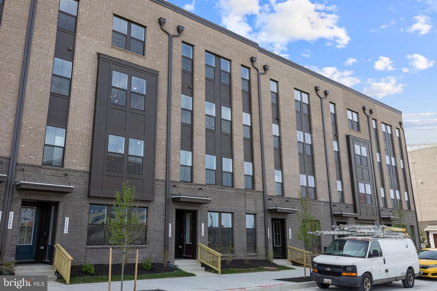 RENTAL AVAILABLE JANUARY 1, 2026 - A stunning 3BR/2.5BA second floor condo located in the desirable community of Locke Landing in the Baltimore Peninsula. This rental home features two floors of living space with hardwood floors, nine foot ceilings, a one-car garage, and a stunning view from the rooftop deck. The main floor features a large open floor plan featuring a large living room with sliding doors to outside space, a large dining room with a built-in banquet, a half bath and stunning new kitchen. The gourmet kitchen features mixed metals beginning with the gold accents on the white GE Cafe appliances which includes a six burner gas slide in range and a combination wall oven/microwave, plenty of cabinets with stainless hardware, open shelving, sleek quartz countertops with a subway tile backsplash, and a stainless sink set into a large island with waterfall ends, elegant lighting fixtures, and breakfast seating for four or more. On the second floor are two sizable secondary bedrooms with a full bath, a laundry room, and a primary suite. The primary offers not one, but two walk-in closets, and a private en suite with his/hers vanities, and a spacious walk-in shower with a built-in bench and rainfall shower head. This second floor unit includes access to an amazing rooftop deck with views of the water and UA headquarters. Amenities have not been built yet but there will be a clubhouse, fitness center, pool and walking trail along with 4 green spaces in between future buildings. This RENTAL is located in close proximity to shopping, restaurants, and commuter routes.