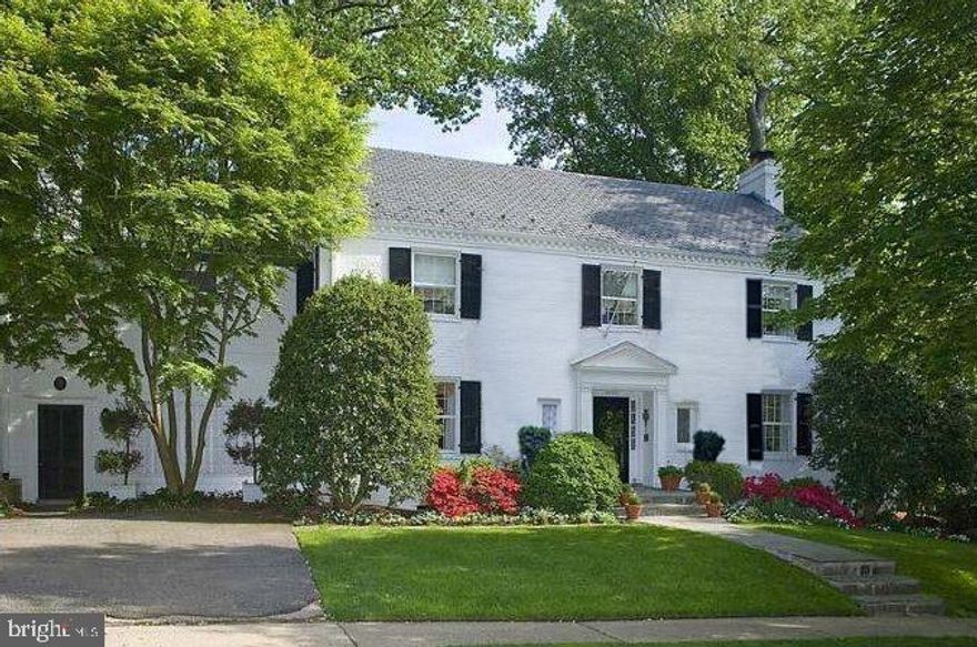 Stately, elegant, and with wonderful curb appeal, this 1940 classic center hall colonial sits on a gorgeous, private lot of just over 1/4 acre in the heart of the coveted Kent neighborhood. The home has been beautifully renovated and maintained by its current owner, and offers approximately 5,200 square feet of finished space over four levels, plus additional unfinished space. The residence provides a wonderful layout and a flow that is is ideal for both entertaining and everyday living. The main level includes beautiful formal Living and Dining Rooms, as well as a Library, and Kitchen open to Family Room, plus a Sunroom. Floor to ceiling windows and doors across the back create an indoor/outdoor living space and overlook the flagstone patios and heated pool, surrounded by lush landscaping, which brings a tranquility and privacy to the setting that is hard to find in the city. Four bedrooms and three full baths are found on the second level, including a wonderful primary suite with balcony overlooking the pool, a spacious dressing room and gorgeous primary bath. An additional two rooms and bath are found on the third level. The lower level features a very spacious Recreation Room with wet bar, an additional Bedroom or Office, a fifth full Bath, exit to the pool area, and ample storage. There are five wood-burning fireplaces in addition to beautiful original details, including crown molding, brass hardware, period doors and more. Residents enjoy nearby shopping and restaurants of Foxhall, Macarthur Boulevard, Georgetown and Chevy Chase, as well as access to nearby parks and the trails of Battery Kemble. Numerous well-regarded private schools are close by, as is the popular Key Elementary School. This is truly a special home in an ideal setting and location!