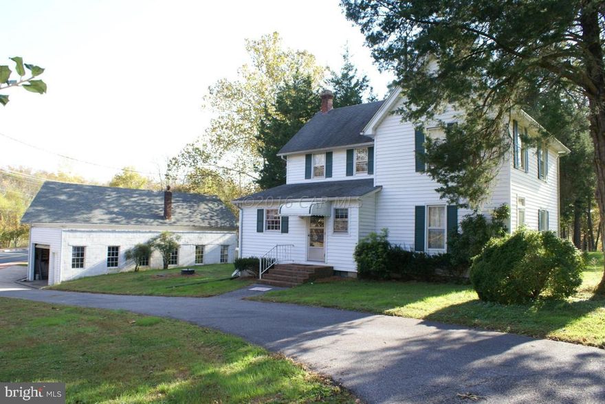 Very Unique waterfront property in the Historic town of Quantico.   House has newer upgrades that include HVAC,  electric, plumbing, paint, well, septic and roof. Large Garage has ample workspace and hydraulic lift. Can be used for commercial use with special exception from the Historic District.
