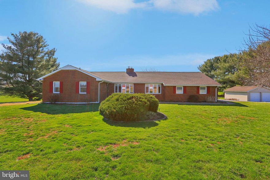 Welcome home to this beautifully maintained, charming three-bedroom, two-and-a-half bath ranch-style retreat, perfectly situated on just over 3 acres surrounded by scenic farmland. From the moment you arrive, you’ll appreciate the peaceful setting, mature trees, and welcoming curb appeal.
Step inside to an semi-open, light-filled layout designed for comfortable everyday living and effortless entertaining. The spacious living room features warm natural light and easy flow into the kitchen and family room. The well-appointed kitchen offers ample cabinetry, generous counter space, and a layout ideal for cooking and gathering.
The private primary suite includes its own en-suite bath, offering a quiet place to unwind. Two additional bedrooms are generously sized and share a well-maintained full bath. A convenient half bath is perfectly located for guests.
Outside, the expansive lot and new deck provide endless possibilities—gardening, play, outdoor dining, or simply relaxing and enjoying the serenity of this property. With its combination of space, comfort, and location, this ranch-style home has the perfect blend of charm and practicality.
Don’t miss your chance to make this beautiful property yours!