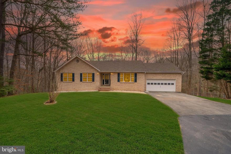 THIS IS THE ONE!  You will fall in love with this renovated rambler with over 2500 square feet of living space, situated on almost 2 acres! The main level won't disappoint with it's abundance of natural light, and open floor plan....to include updated kitchen, large living room, and spacious bedrooms. Master suite has updated master bath attached. Bedroom #2 & #3 are spacious. Laundry/Mud room off kitchen with washer/dryer and a powder room. Lower level is the perfect family room and/or rec room...complete with a fireplace, full bath, and outside entrance. Lower level also has 4th bedroom and bonus room perfect for a game room or office. Deck off rear overlooks private backyard...backs to trees. No HOA! This is one of a kind home that has everything you need....  don't wait, it won't last long!