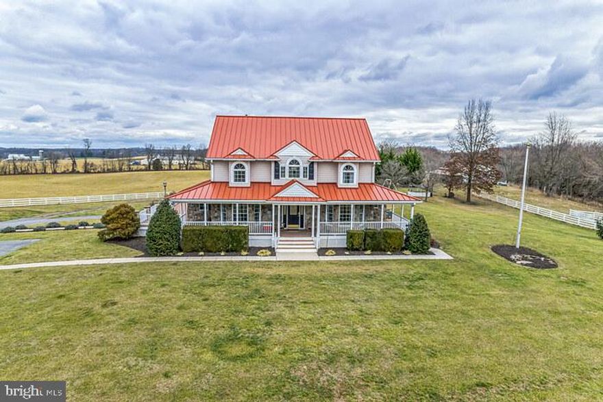 Welcome to a rare gem nestled on 25+ acres of pure serenity! This meticulously updated home seamlessly combines modern luxury with energy efficiency, making it a truly exceptional find. As you approach the property on the long driveway you will enjoy expansive open space and breathtaking views will captivate your senses, setting the stage for an extraordinary living experience. Step inside and the gleaming hardwood floors welcome you to a residence where every detail has been thoughtfully considered. The living room, which can be easily transformed into a library or office, boasts ample windows that invite the beauty of the surroundings indoors. Imagine yourself immersed in a good book, with the majestic mountain views as your backdrop. The family room is a cozy retreat featuring a captivating stone wall with a gas fireplace, creating the perfect ambiance for relaxation. Open the French door to reveal a rear deck, extending your living space outdoors for gatherings and quiet moments alike.
The heart of this home is undoubtedly the gourmet kitchen, a chef's delight that has been tastefully updated with painted cabinets, new fronts, a stylish range hood, a tile backsplash, and brass pulls. Granite countertops and a breakfast bar adorned with a stone wall make this space both functional and aesthetically pleasing. Enjoy the abundance of natural light streaming through plenty of windows, creating a warm and inviting atmosphere. A table space breakfast area and a formal dining room adjacent to the kitchen provide versatile options for meals and entertaining.  The upper level of this remarkable home boasts four additional bedrooms, each adorned with gleaming hardwood floors and offering the perfect blend of comfort and style. Bedrooms on the upper level are attached to a buddy bath this level ensures convenience for family and guests, featuring modern finishes and the added luxury of walk-in closets. Designed with flexibility in mind, this home features a main-level owner's bedroom.  Each additional bedroom offers a door to the buddy bath. Plus two laundry rooms one on the main and one on the upper level. As you explore the full basement, a world of possibilities unfolds. This space is not just an extension of the home but a destination in itself. Imagine cozy evenings by the gas fireplace, a fully equipped kitchen for entertaining, and a den that invites relaxation. A full bath adds practicality to this level, ensuring comfort and convenience. Additionally, ample storage space allows you to keep everything organized and easily accessible. Experience the seamless flow of hardwood and tile floors across three amazing levels, creating an aesthetic continuity that ties the entire home together. The thoughtfully designed interior is not only visually appealing but also ensures comfort and functionality at every turn.

Now, let's talk about the outbuilding—a large garage workshop building that stands as a testament to the property's versatility. With its electric supply, this space is a dream for hobbyists, tinkerers, or anyone in need of a spacious workshop. The barn shed, perfect for horses, adds an equestrian dimension to the property, while the vast grounds provide ample space for gardening and cultivating your crops.

The possibilities for a business venture on your property are indeed limited only by your imagination, creativity, and willingness to explore different options. Here are a few more ideas to spark your imagination: Lavender farm,  Organic Farming, Winery, Horse Farm.  Of course, you would need to check zoning with your ideas.  

Indulge in the perfect blend of sophistication, comfort, and nature in this rare property that offers not just a home but a lifestyle—one that harmoniously integrates modern amenities with the beauty of the great outdoors. Your dream home awaits!